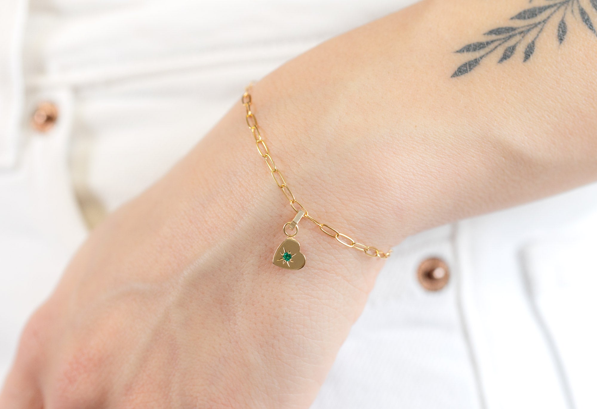 10k Yellow Gold Emerald Heart Charm on Bracelet Chain on Model