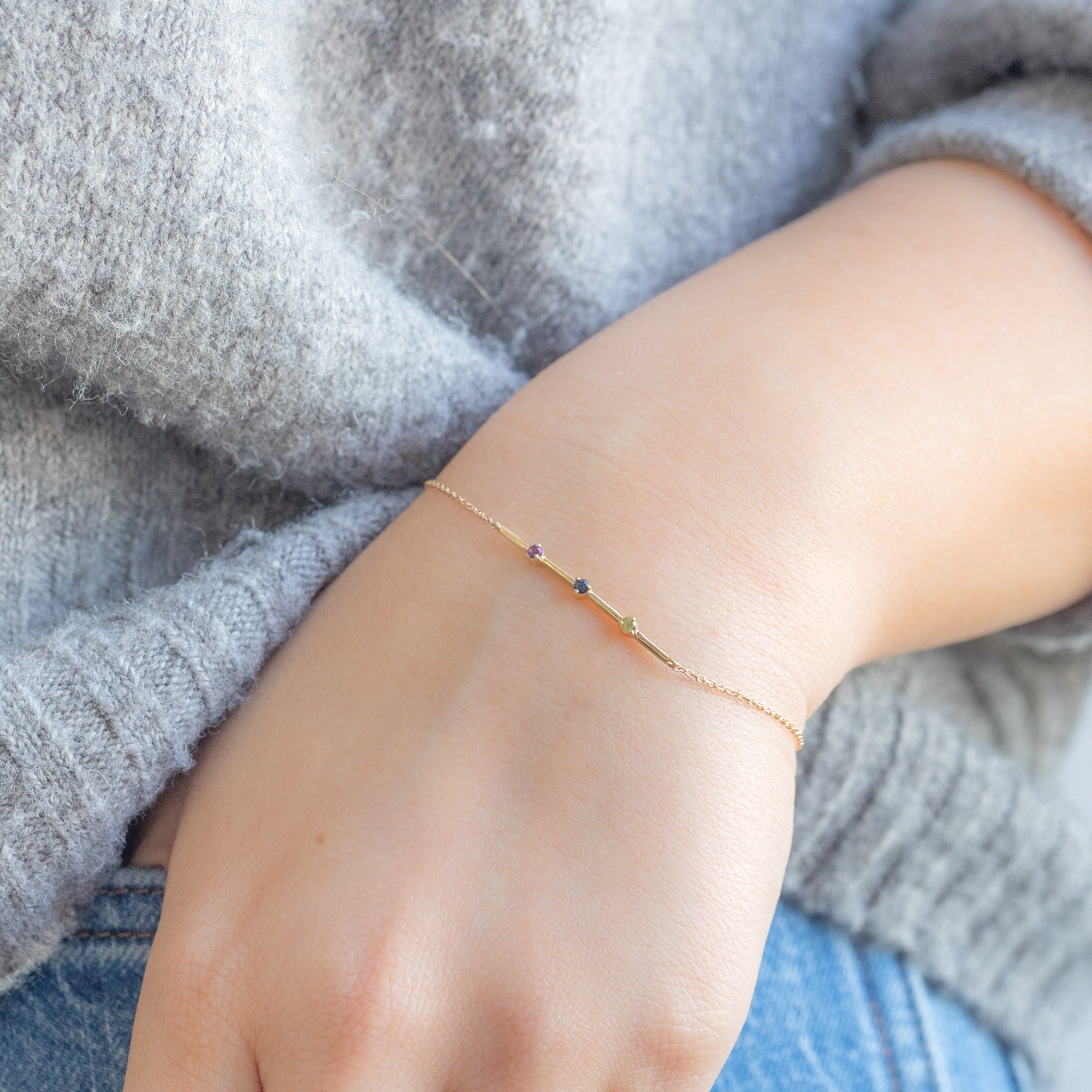 The Custom Multi-Birthstone Bracelet 3 Stone Option on Model