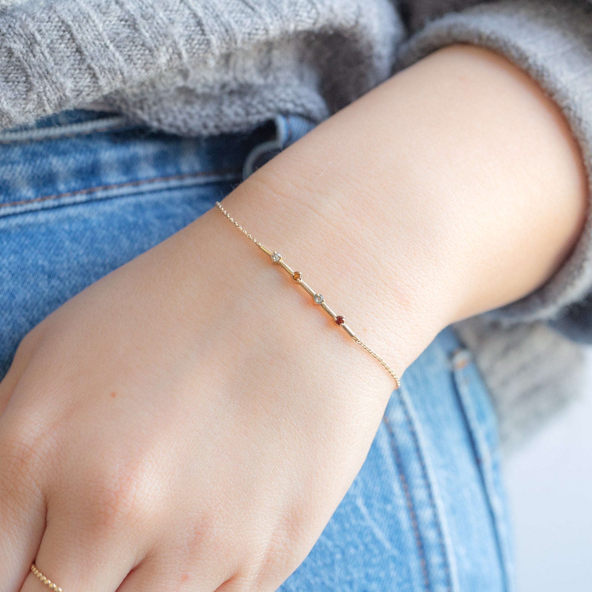 The Custom Multi-Birthstone Bracelet 4 Stone Option on Marble
