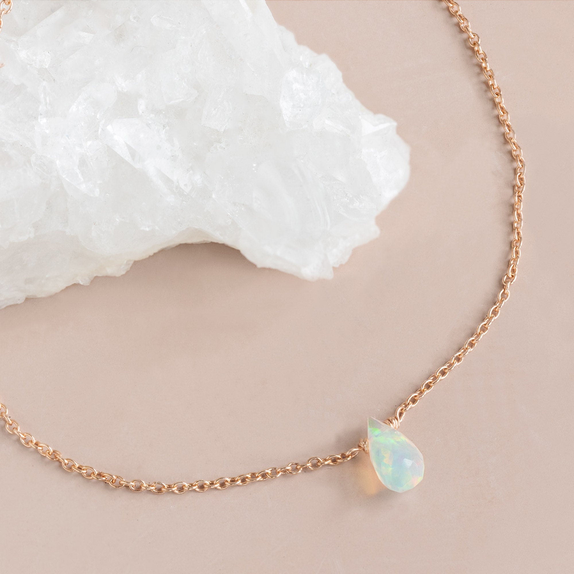 The Opal Teardrop Bracelet in Rose Gold Filled on Peach Background