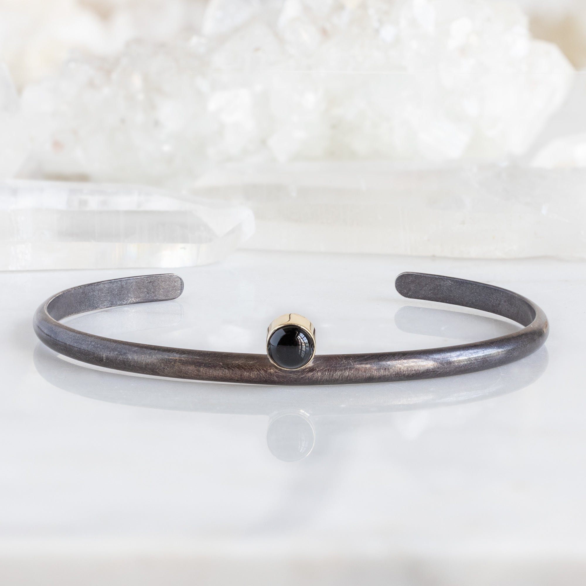 The Onyx Cuff Bracelet in Oxidized Sterling Silver on White Marble