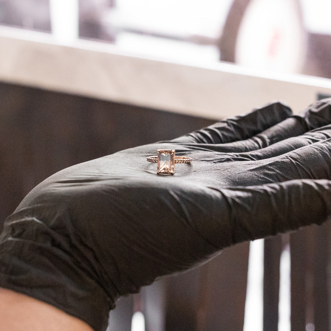 ring in gloved hand