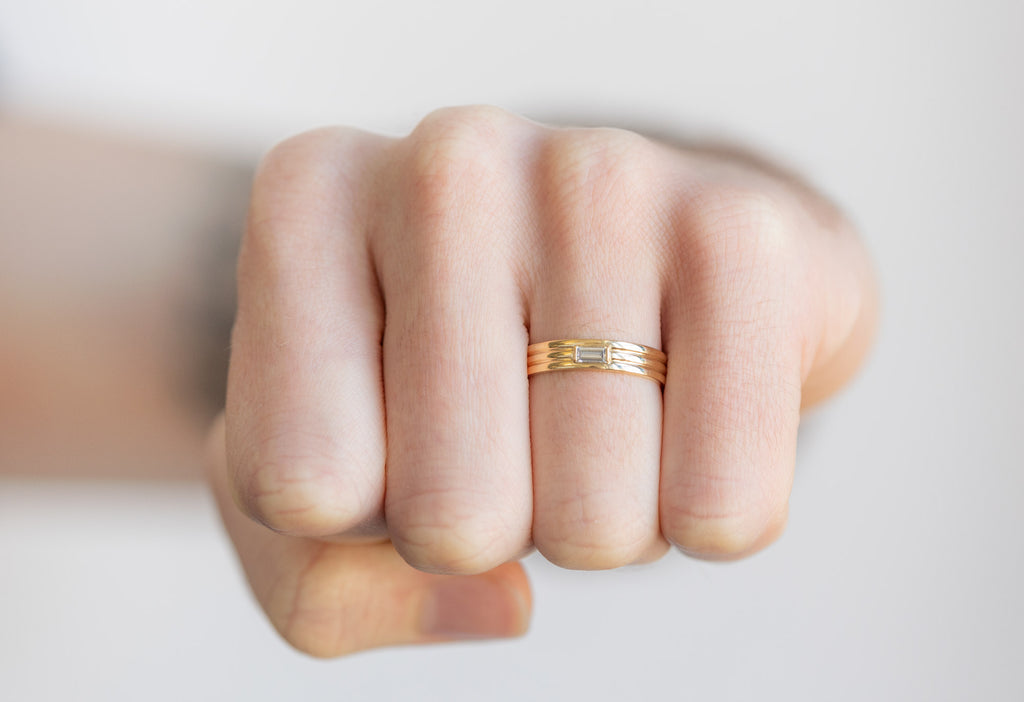 18k Yellow Gold Baguette Trio Stacking Ring on Model making a fist