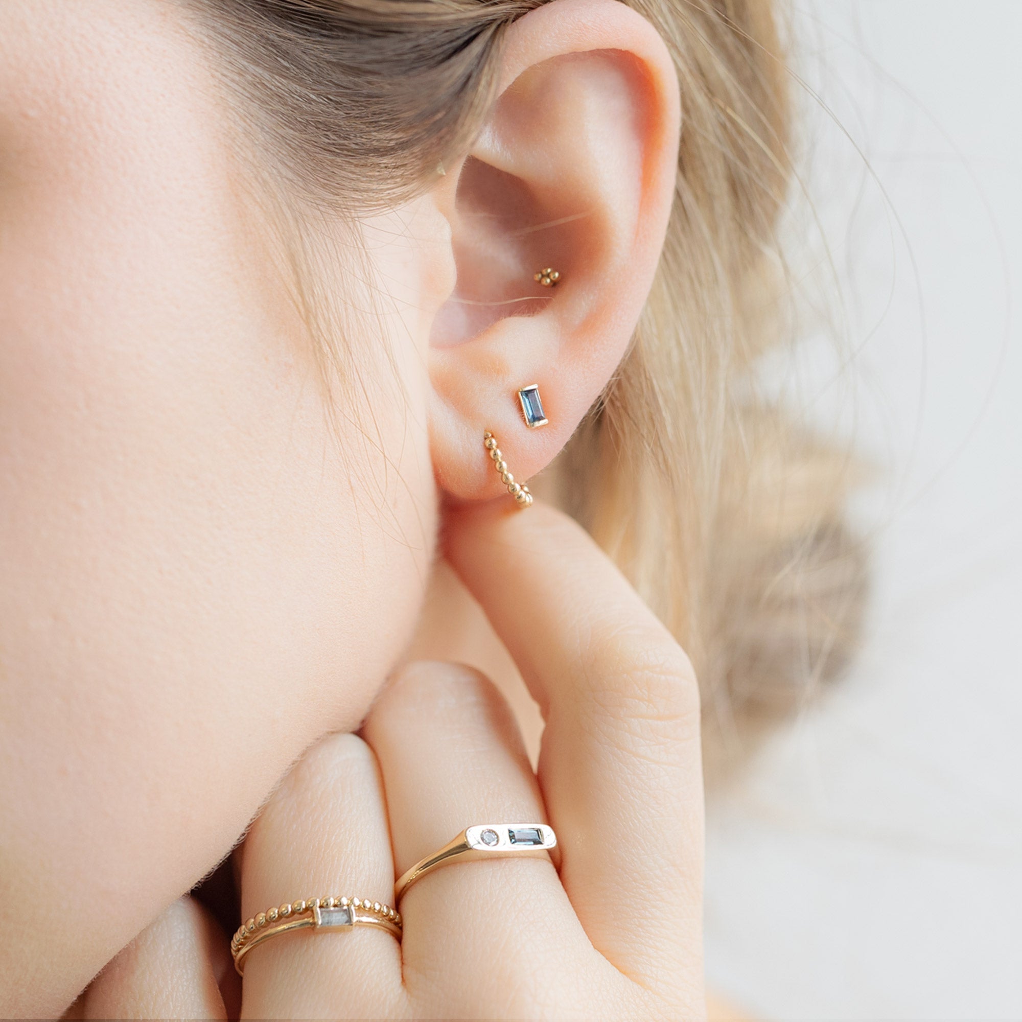 buy:the-montana-sapphire-baguette-studs-10k-yellow-gold,the-beaded-huggie-hoops-14k-yellow-gold,the-asymmetrical-sapphire-diamond-signet-ring-10k-yellow-gold,the-baguette-salt-and-pepper-diamond-line-ring-10k-yellow-gold,the-gold-beaded-stacking-ring-14k-yellow-gold