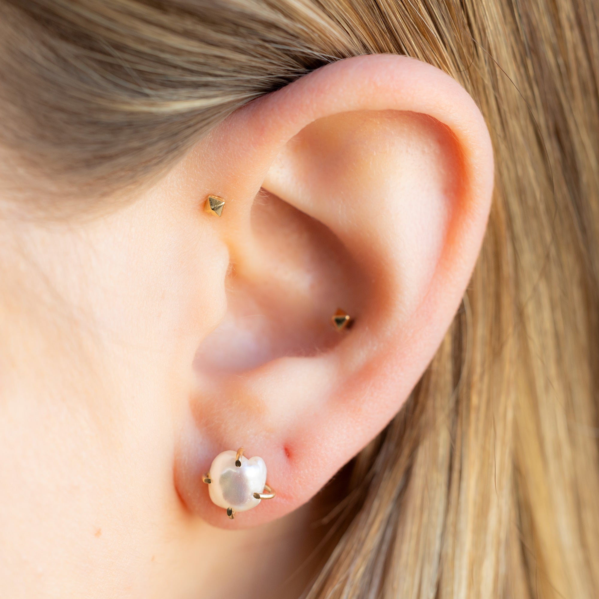The Keshi Pearl Stud Earrings in 14K Yellow Gold on Model