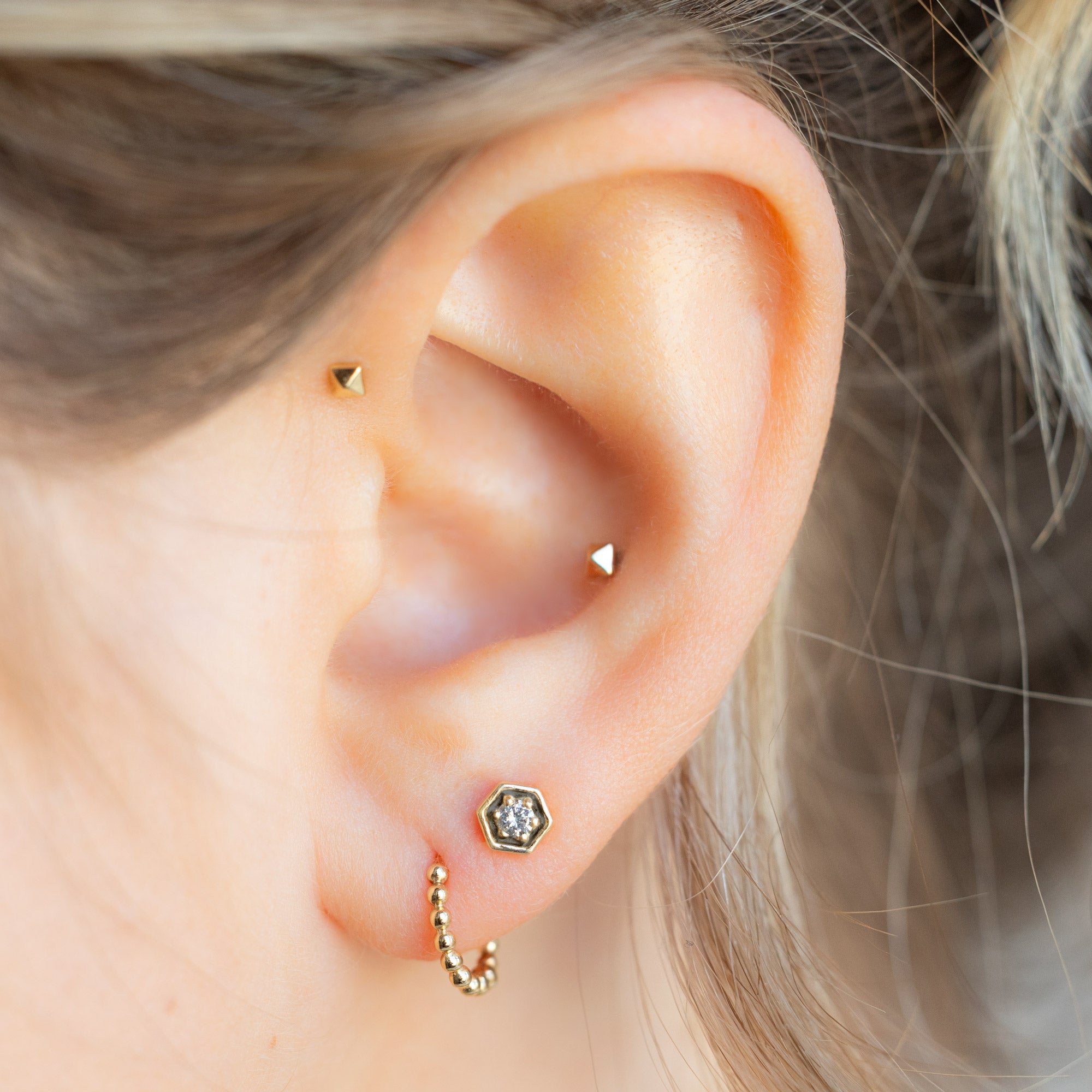 buy:the-galaxy-salt-and-pepper-diamond-hexagon-stud-earrings-14k-yellow-gold,the-beaded-huggie-hoops-14k-yellow-gold