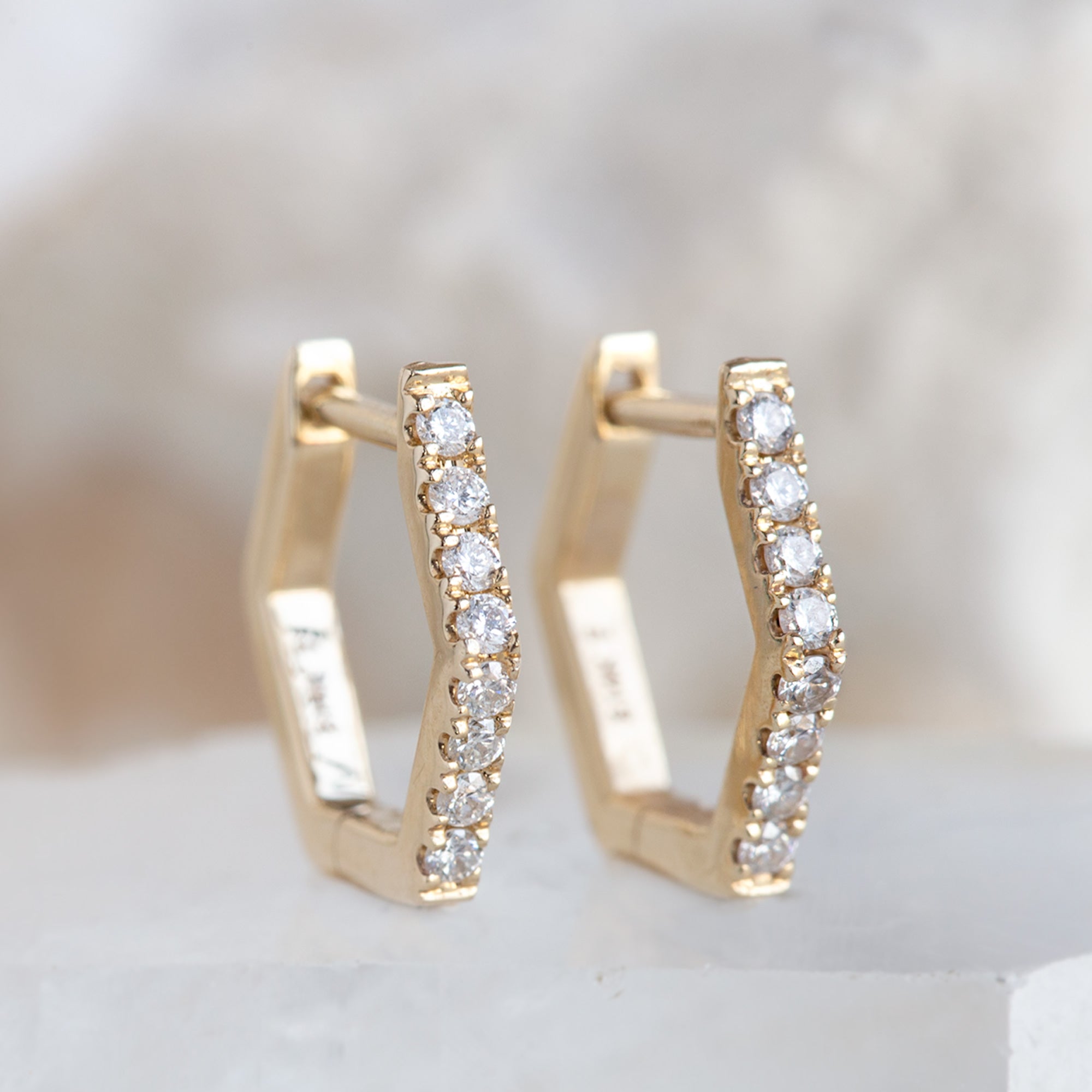 The White Diamond Pavé Hexagon Hoops in 14K Yellow Gold on White Crystal
