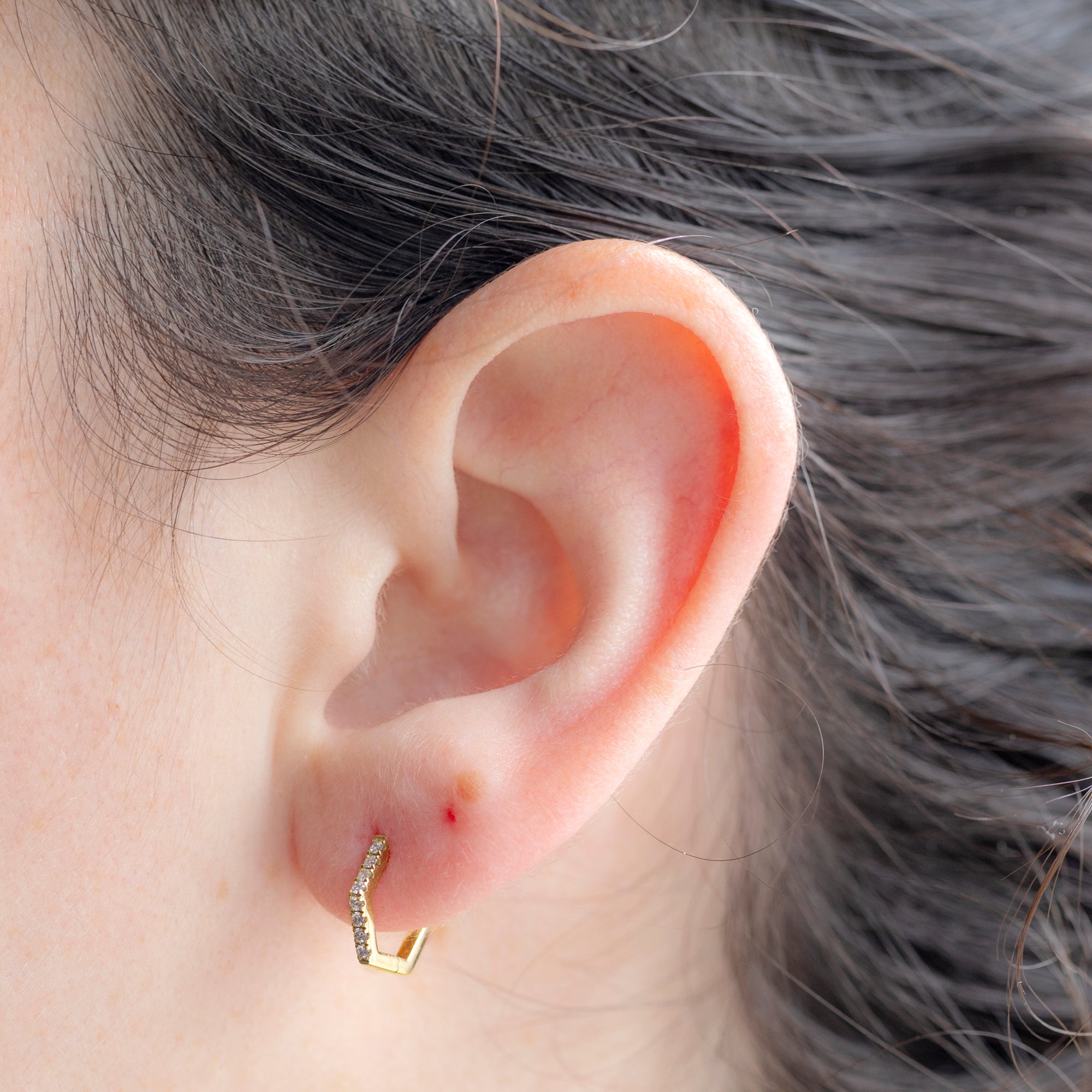 The White Diamond Pavé Hexagon Hoops in 14K Yellow Gold on Model