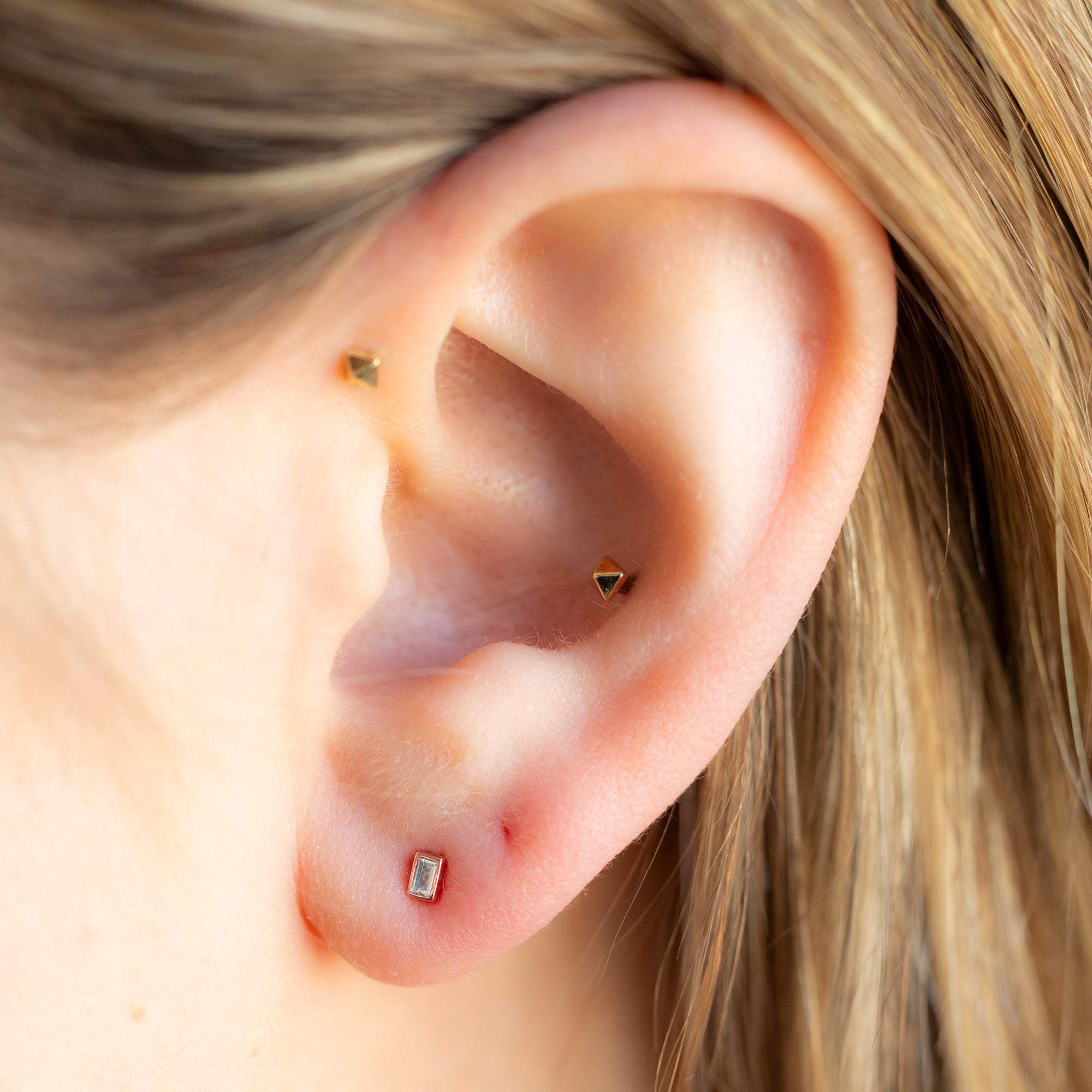 The White Diamond Baguette Stud Earrings in 14k Rose Gold on Model