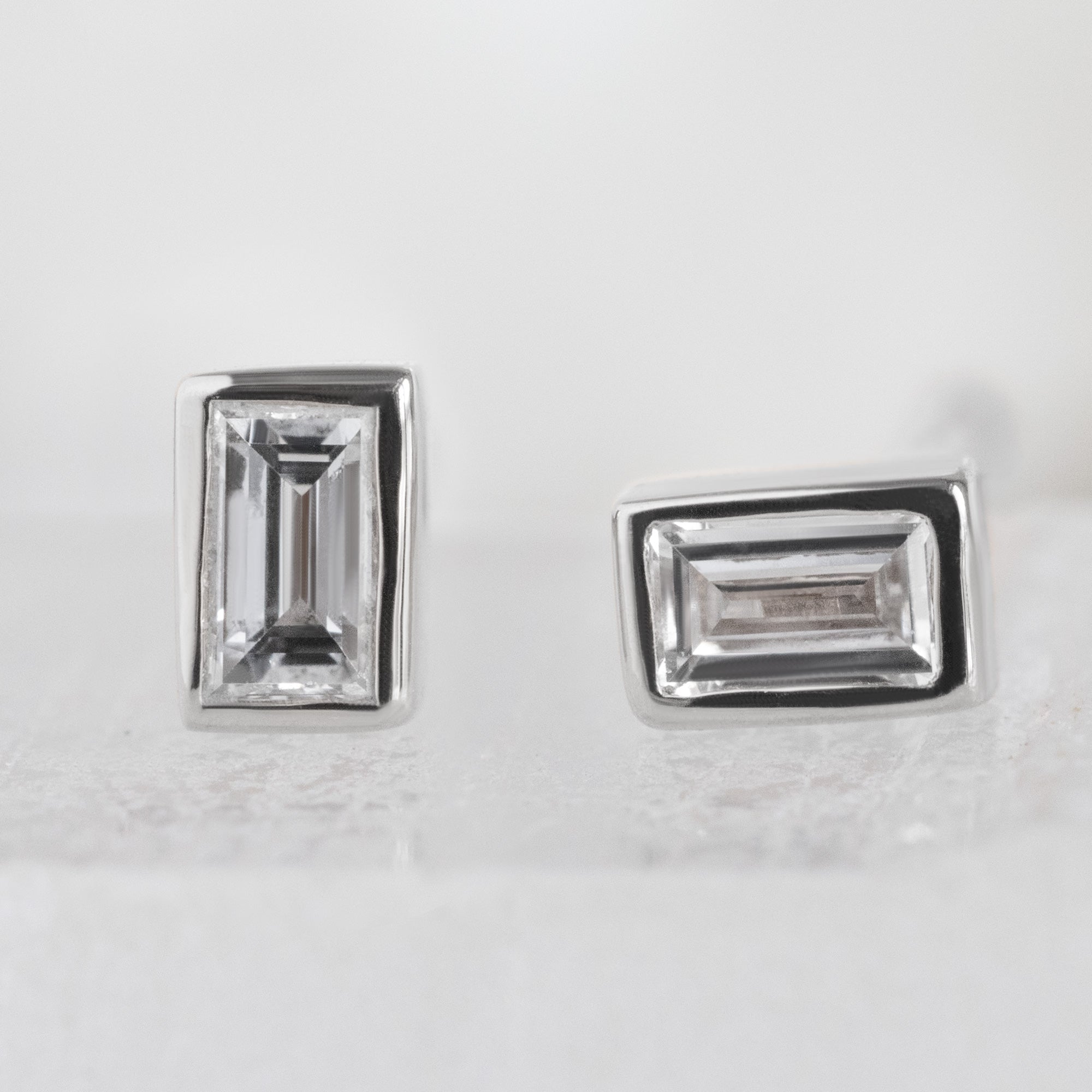 The White Diamond Baguette Stud Earrings in 14k White Gold on White Crystal