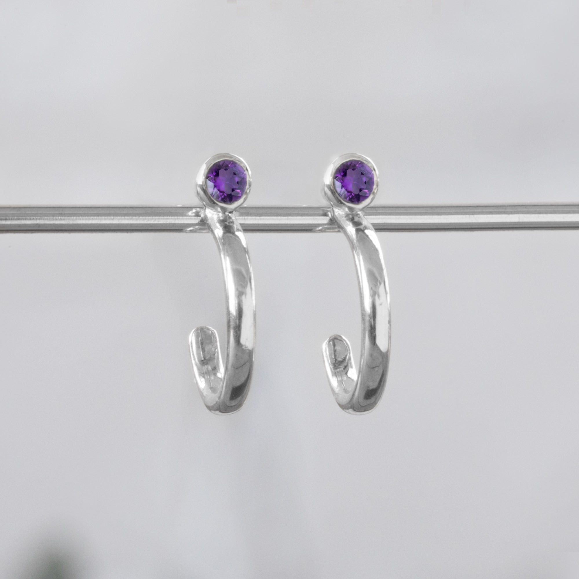 Custom Amethyst Birthstone Hoop Earrings | 14K White Gold
displayed on bar