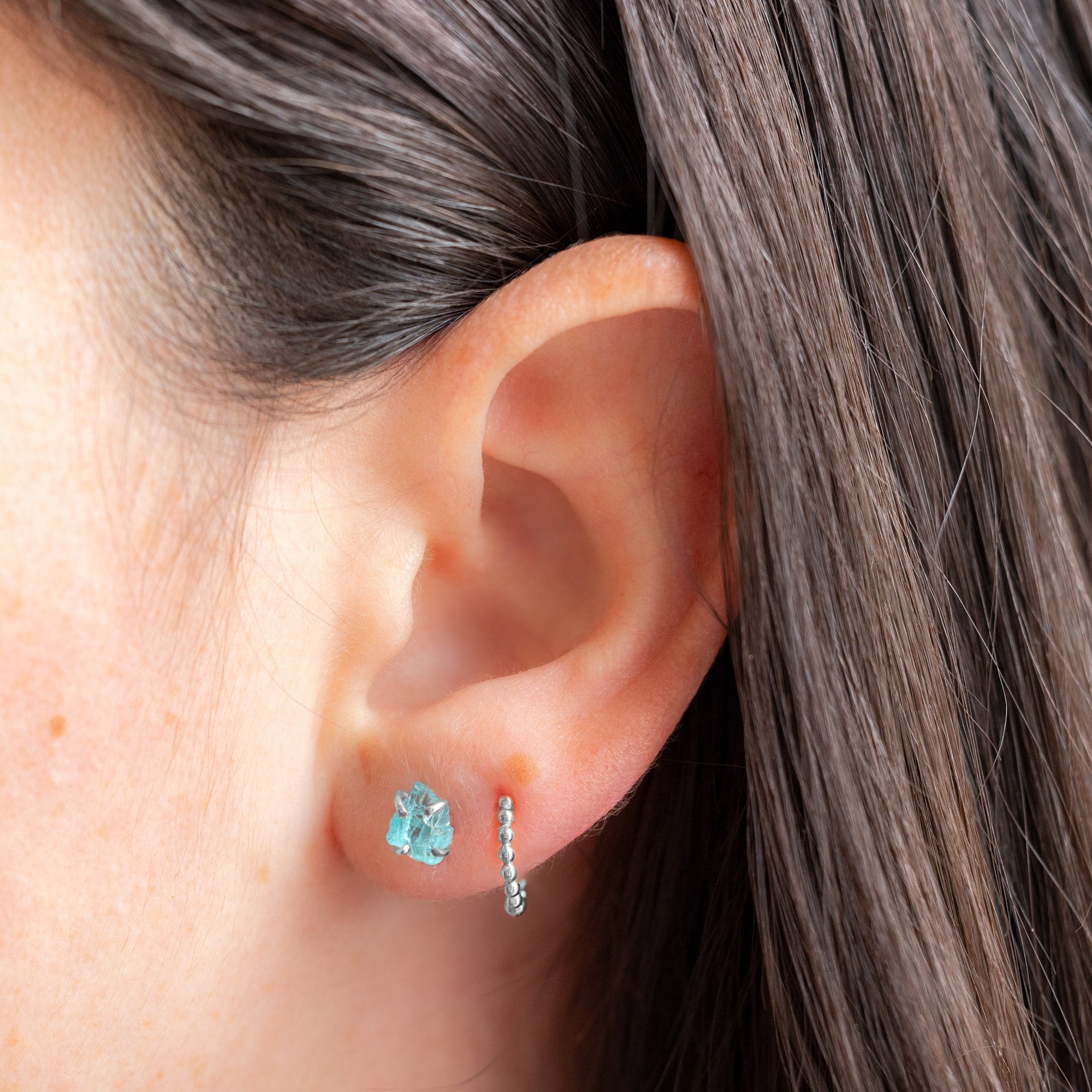 buy:the-beaded-huggie-hoops-14k-yellow-gold,the-raw-aquamarine-gemstone-stud-earrings-sterling-silver