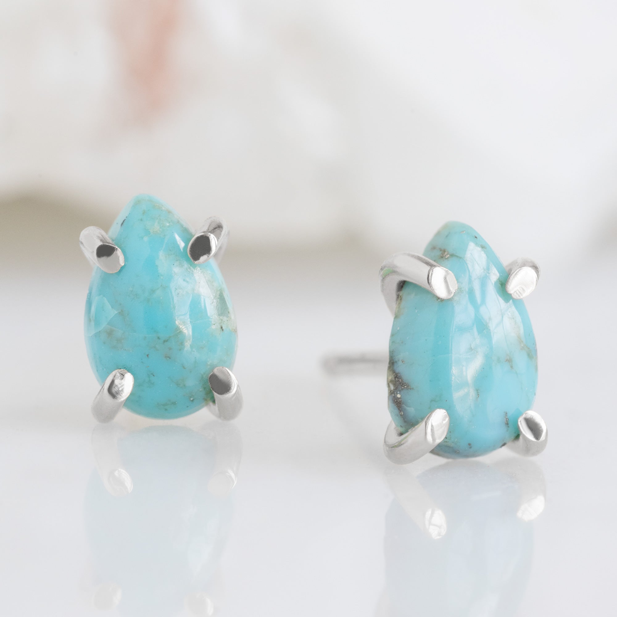 The Turquoise Stud Earrings in Sterling Silver on White Crystal
