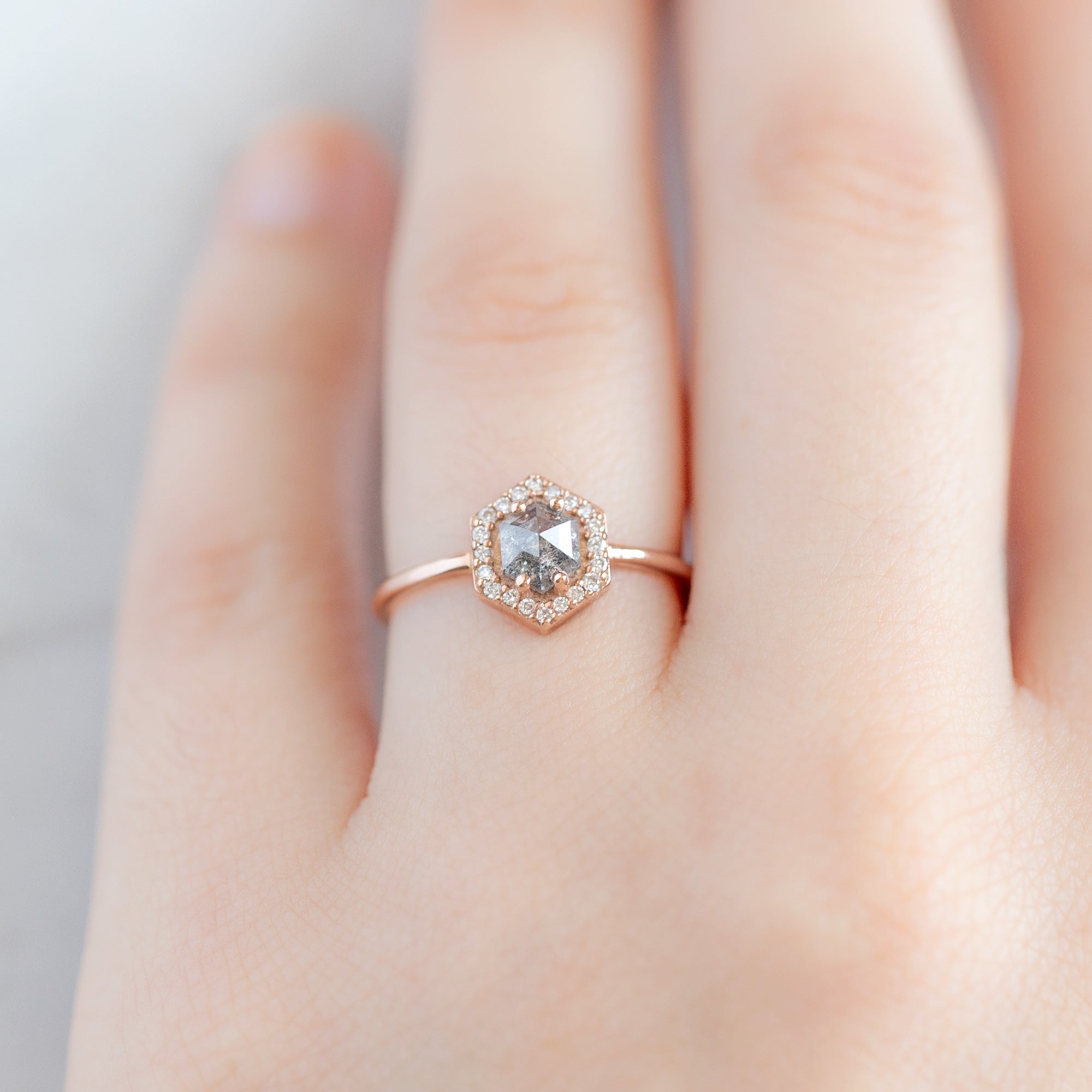 The Dahlia Ring with a 0.89ct Hexagon Salt and Pepper Diamond in 14K Rose Gold on Model