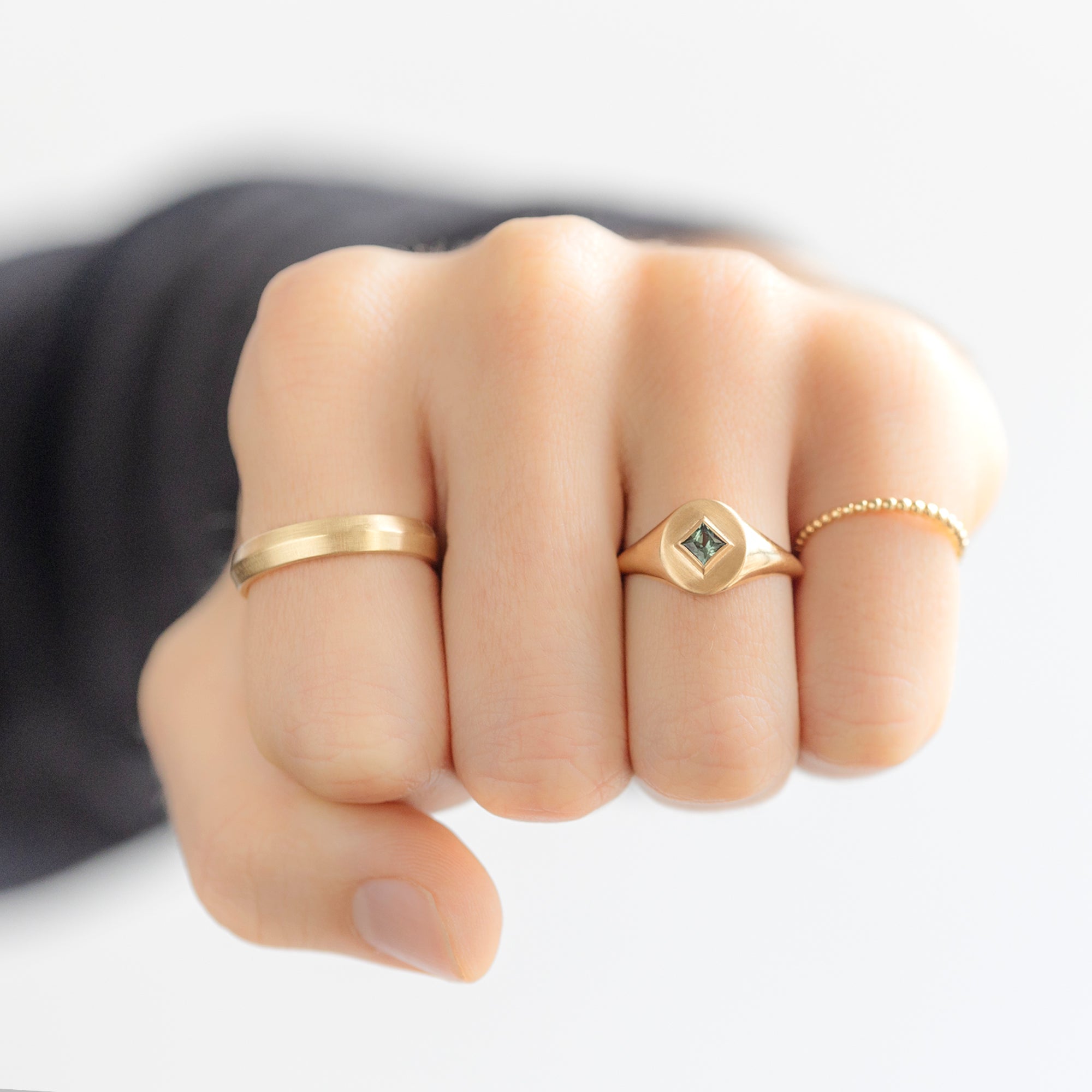 buy:the-knife-edge-wedding-band-14k-yellow-gold,the-signet-ring-0-40ct-kite-montana-sapphire-in-10k-yellow-gold,the-gold-beaded-stacking-ring-14k-yellow-gold