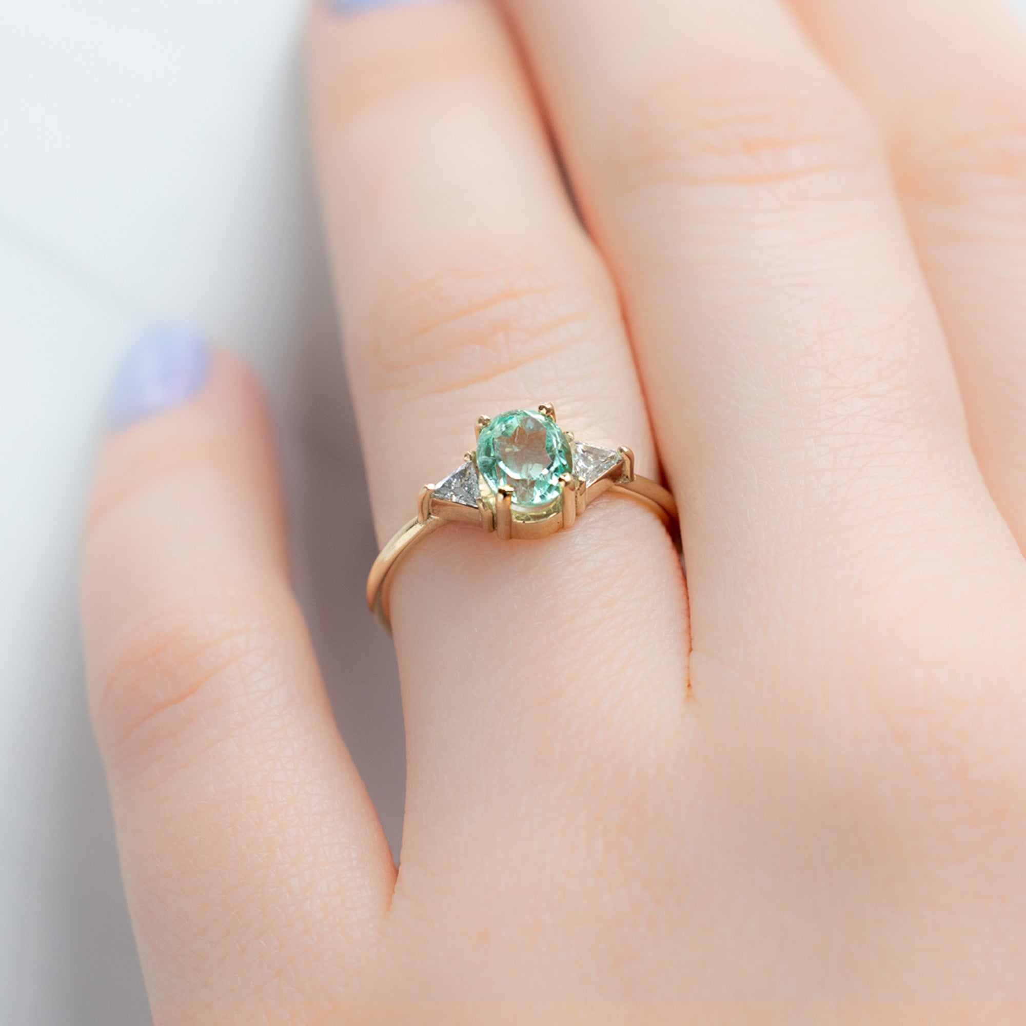 The Jade Ring with a 0.89ct Oval Emerald in 14K Yellow Gold on Model