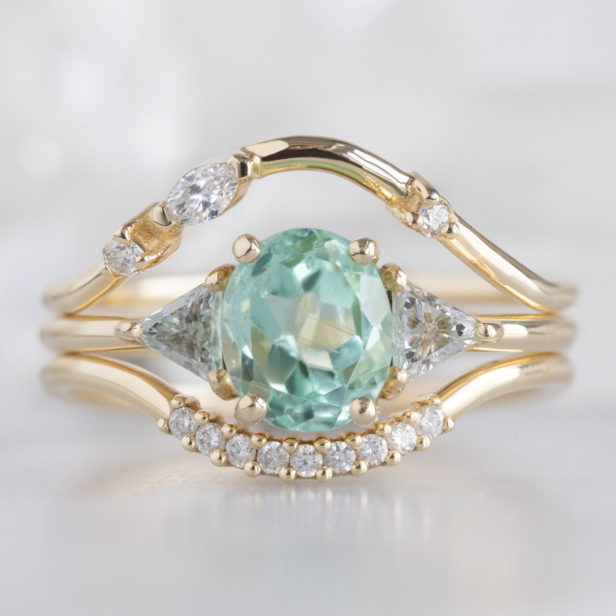 buy:asymmetrical-marquise-diamond-arc-stacking-band-in-14k-yellow-gold,the-jade-ring-0-89ct-oval-emerald-in-14k-yellow-gold,white-diamond-pave-arc-stacking-band-14k-or-18k-yellow-gold