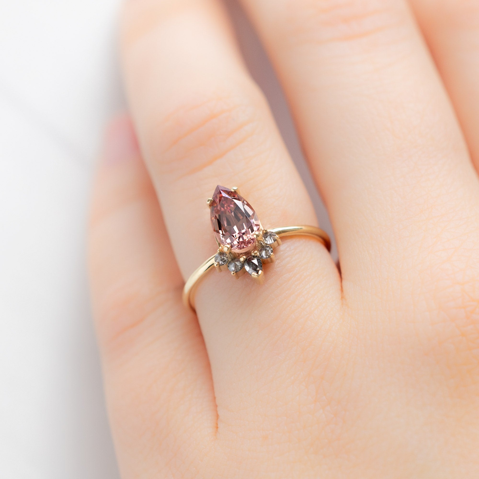 The Aster Ring with a 1.59ct Pear Garnet in 14K Yellow Gold on Model