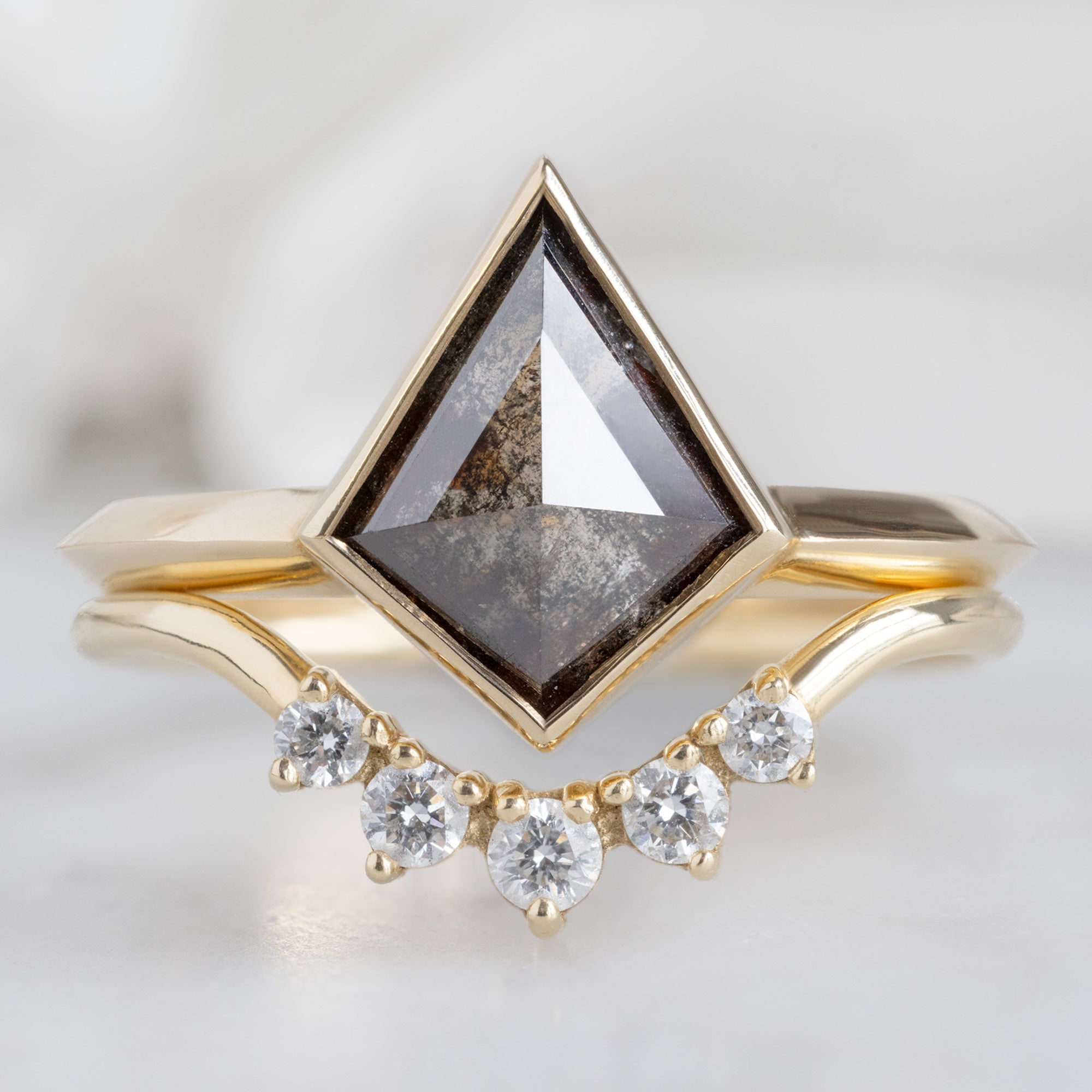 The Hazel Ring with a 1.31ct Kite Black Diamond in 14K Yellow Gold Stacked with the Round White Diamond Sunburst Stacking Band