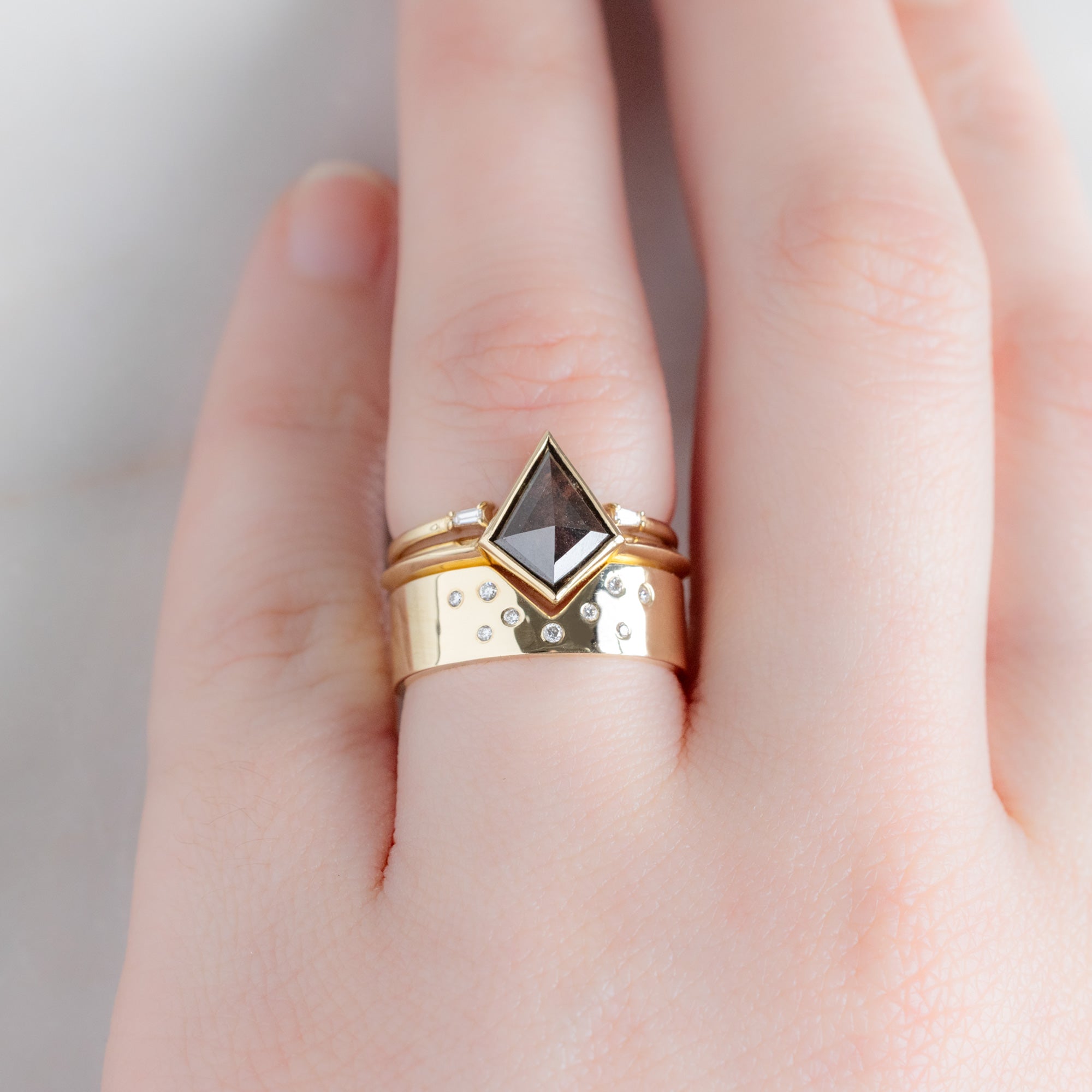buy:open-cuff-baguette-white-diamond-stacking-band-14k-or-18k-yellow-gold,the-hazel-ring-1-31ct-kite-salt-and-pepper-diamond-in-14k-yellow-gold,constellation-cut-out-stacking-band-peak-cut-out-in-14k-white-gold