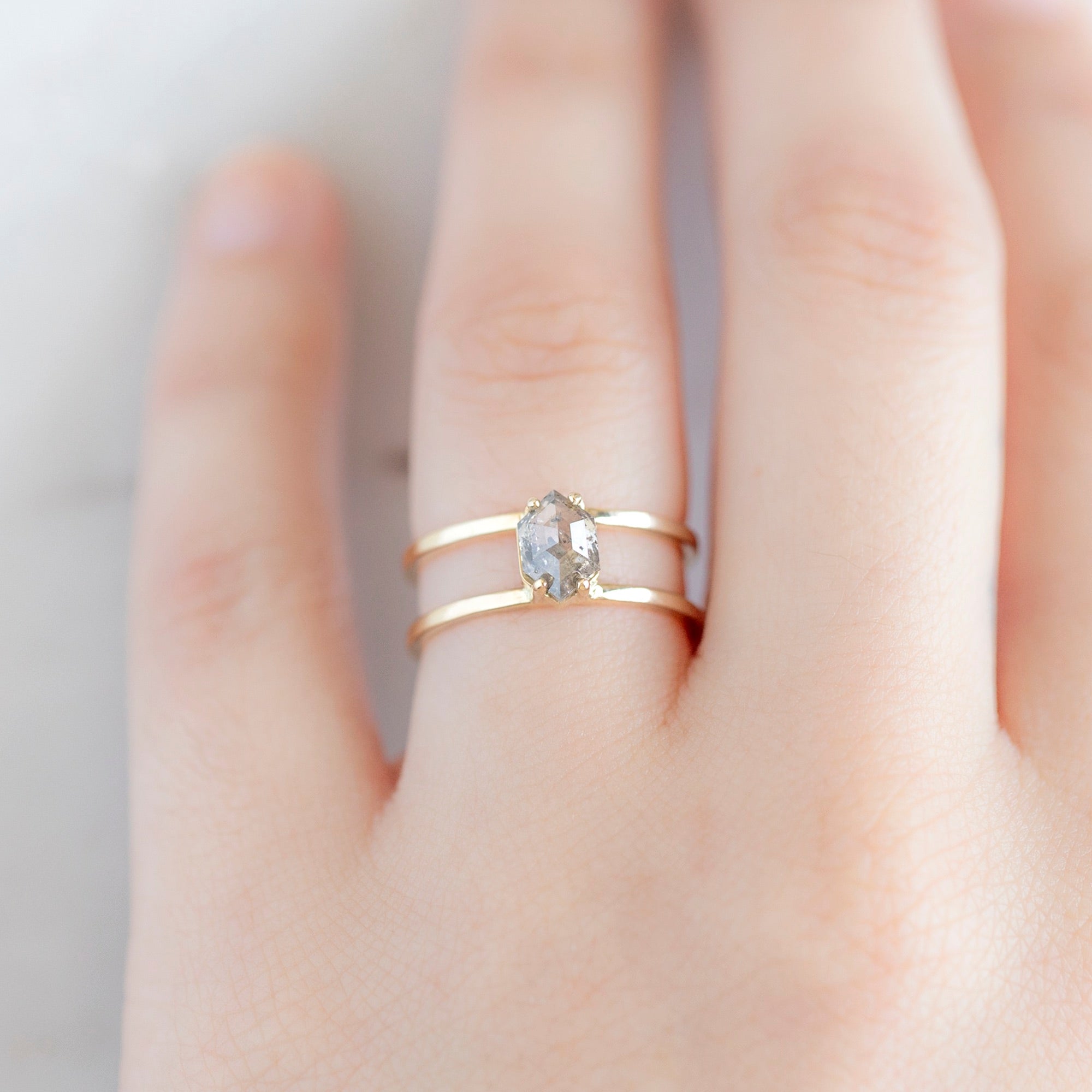 The Poppy Ring with a 1.02ct Hexagon Salt and Pepper Diamond in 14K Yellow Gold on Model