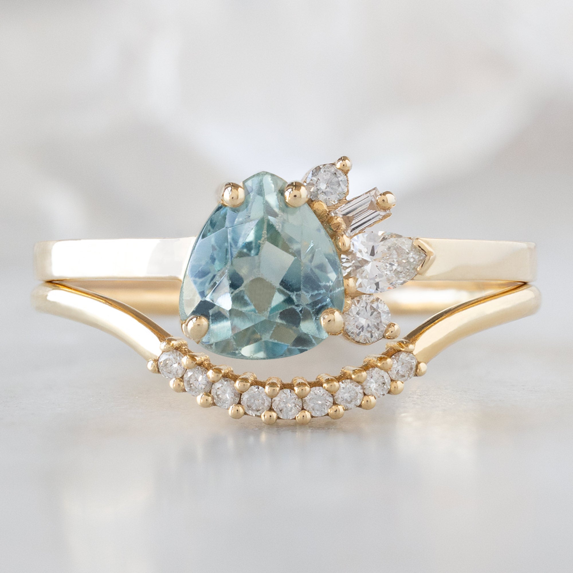 The Cluster Ring | 0.84ct Pear Cut Montana Sapphire in 14K Yellow Gold