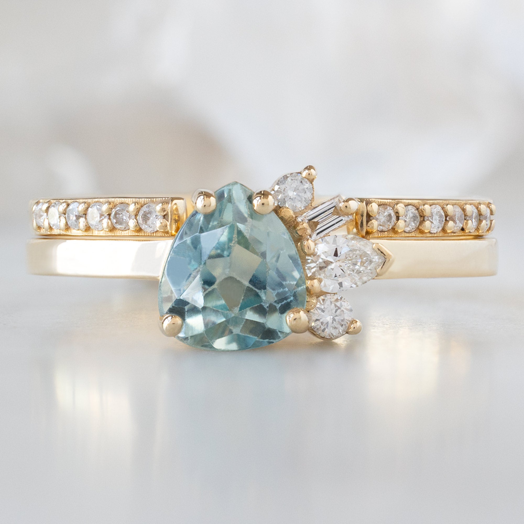 The Cluster Ring | 0.84ct Pear Cut Montana Sapphire in 14K Yellow Gold