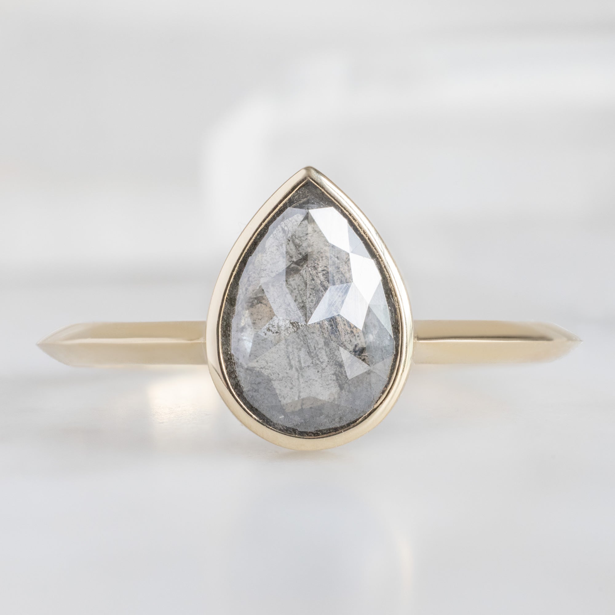 The Hazel Ring with a 1.28ct Rose Cut Salt and Pepper Diamond in 14K Yellow Gold on White Marble