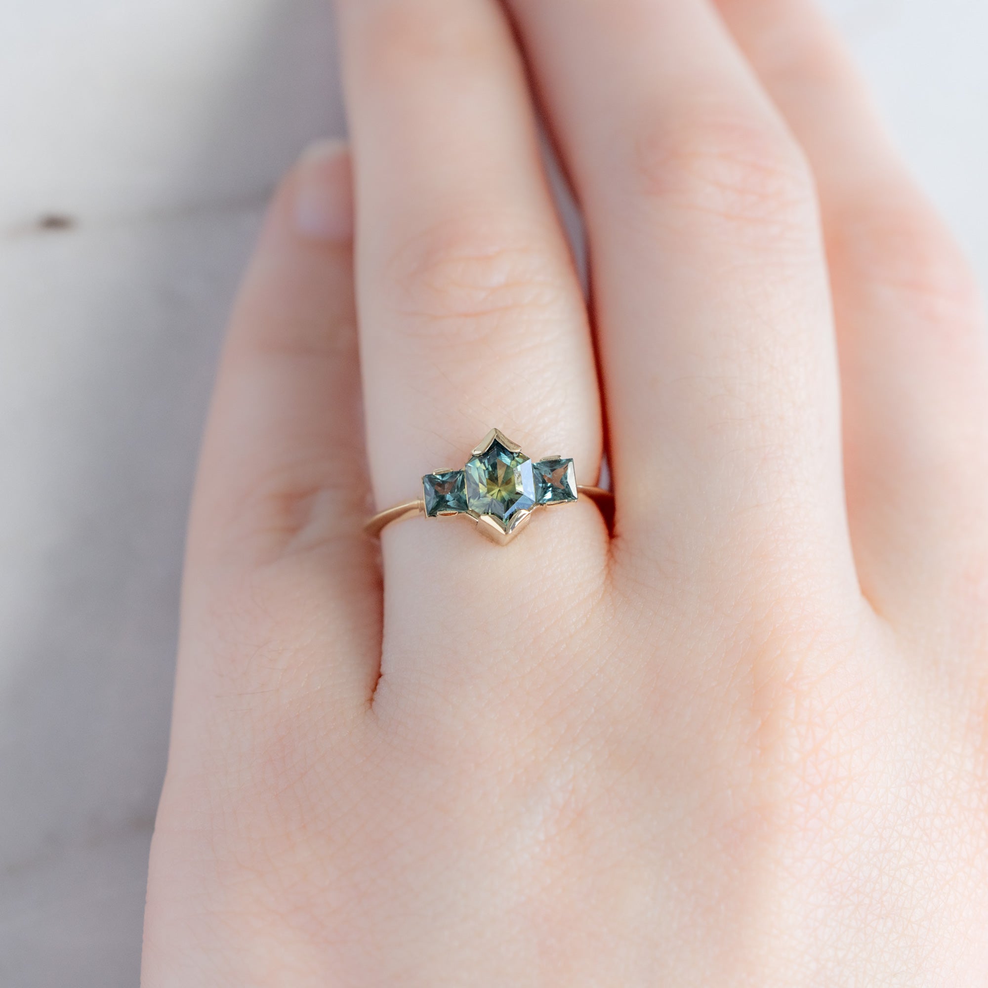 The Watercolor Ring with a 1.2ct Hexagonal Parti Sapphire in 14K Yellow Gold on model