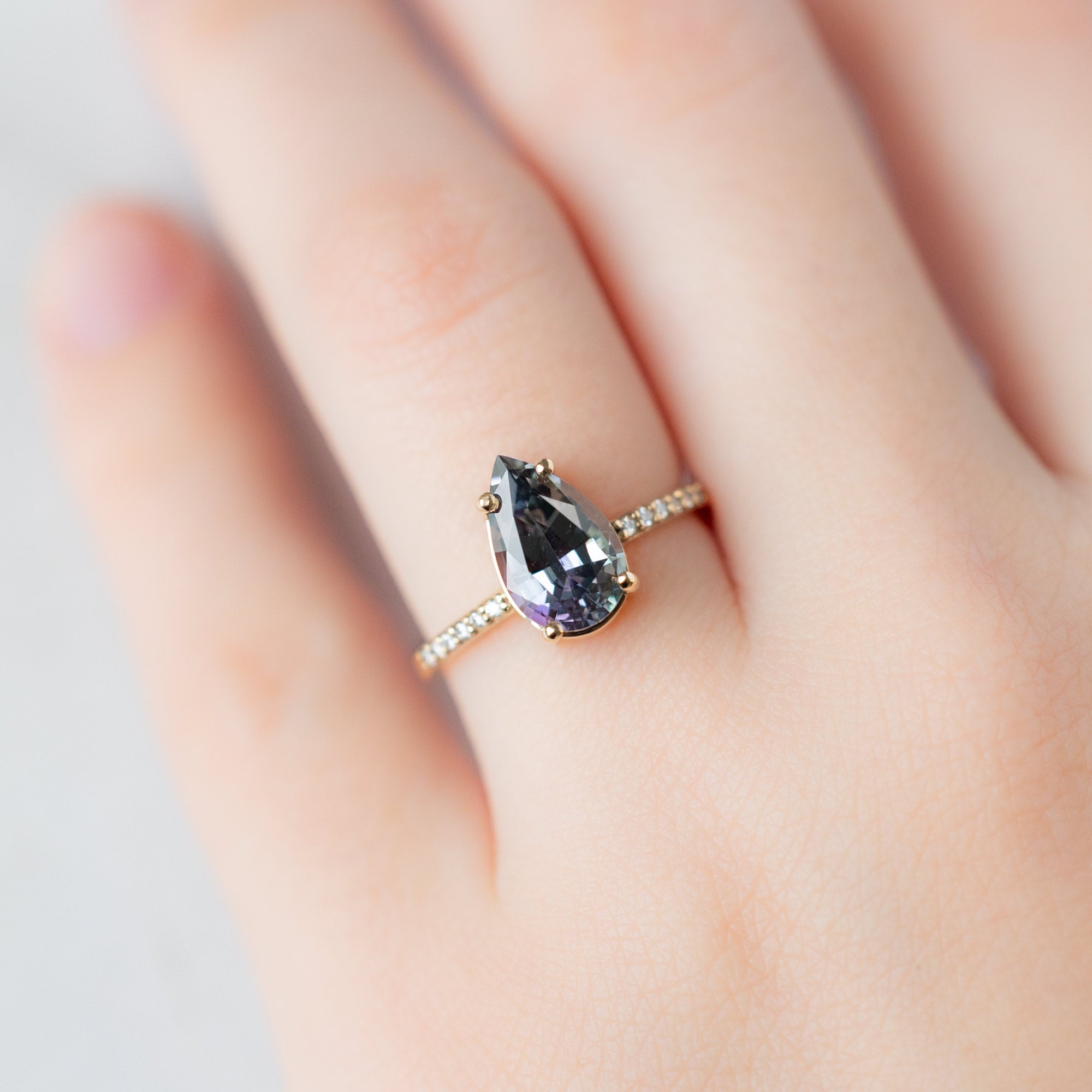 The Willow Ring with a 2.26ct Pear Tanzanite in 14K Yellow Gold on Model