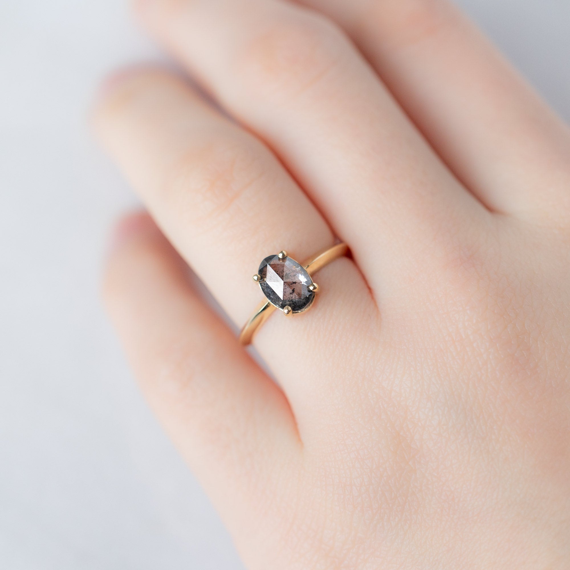 The Bryn Ring with a 1.41ct Oval Salt and Pepper Diamond in 14K Yellow Gold on Model