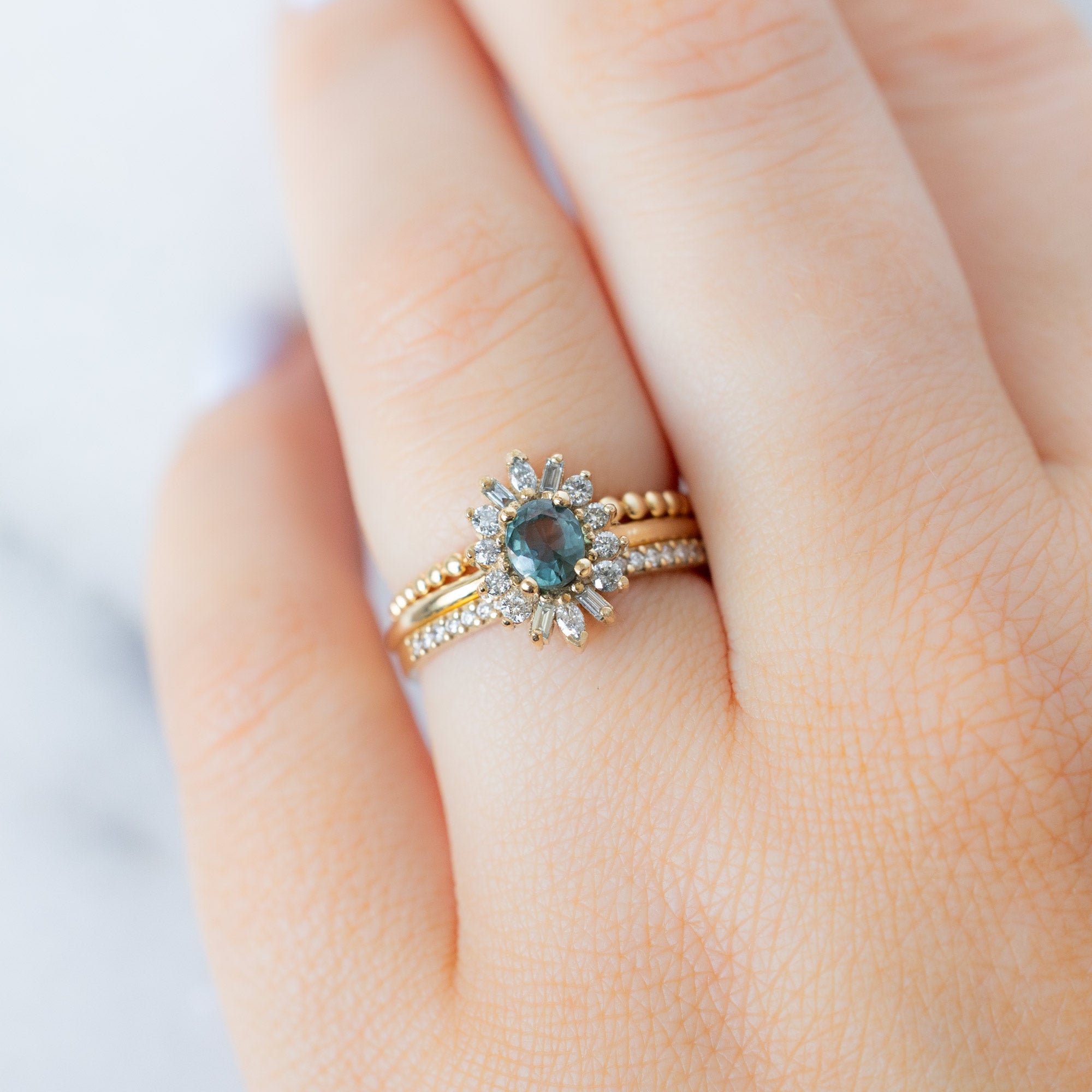 buy:the-gold-beaded-stacking-ring-14k-yellow-gold,the-camellia-ring-0-81ct-oval-blue-montana-sapphire-in-14k-yellow-gold,the-white-diamond-pave-wedding-band-14k-or-18k-yellow-gold