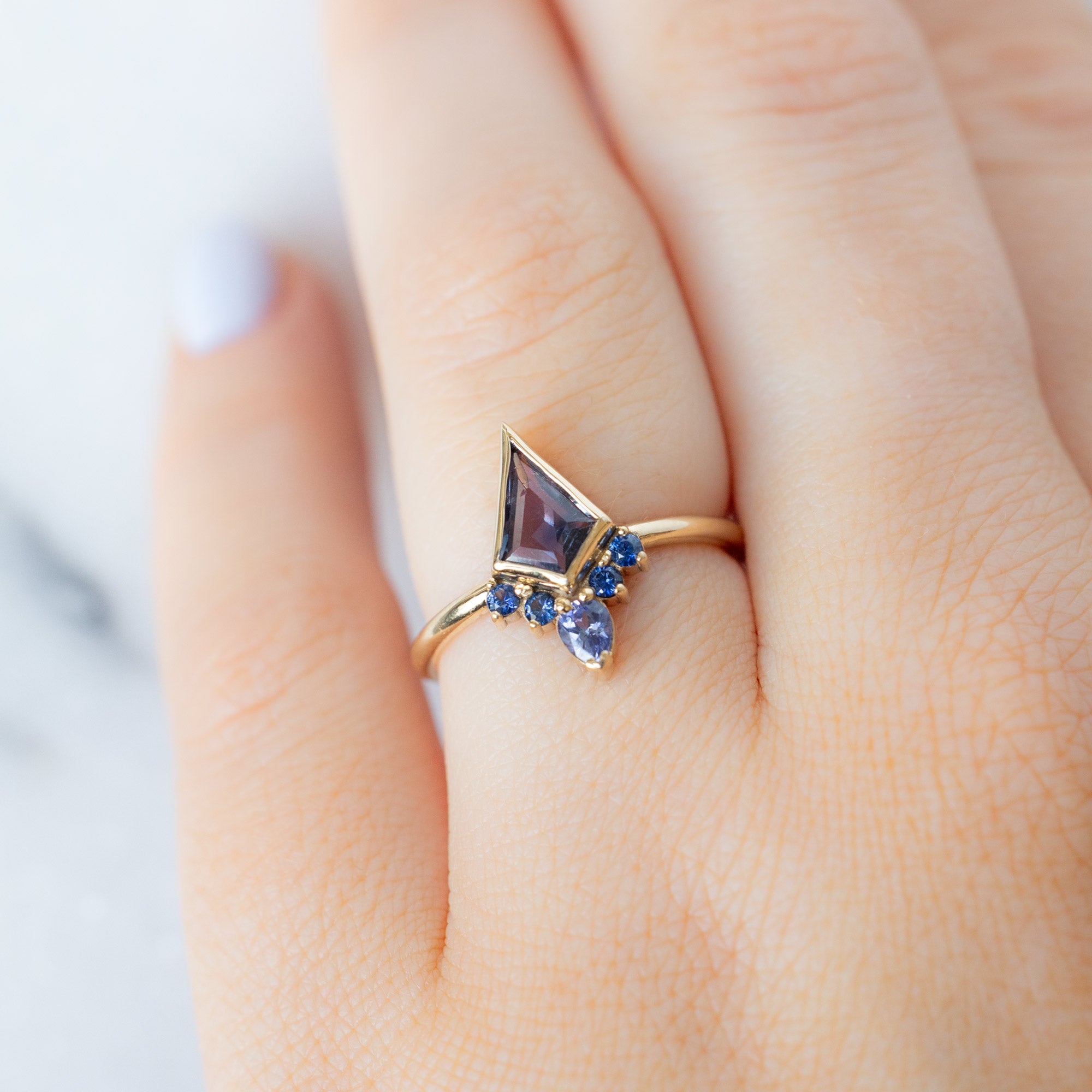 The Watercolor Aster Ring with a 0.83ct Violet Kite Sapphire in 14K Yellow Gold on Model