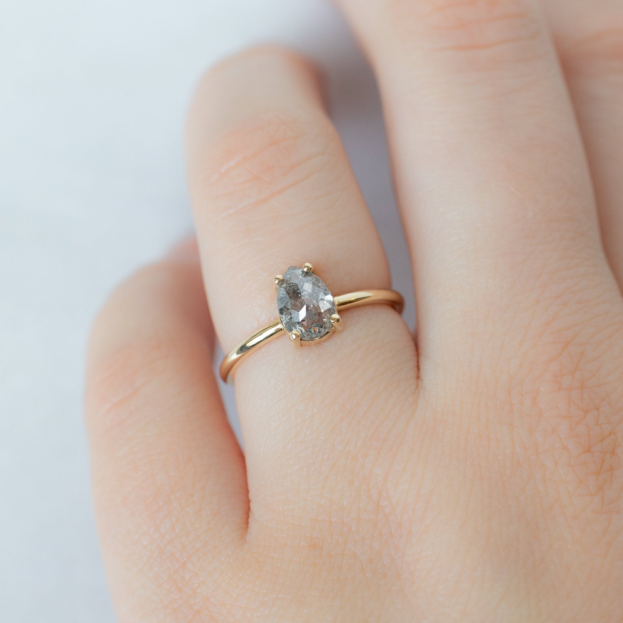 The Bryn Ring with a 1.10ct Pear Salt and Pepper Diamond in 14K Yellow Gold on Model