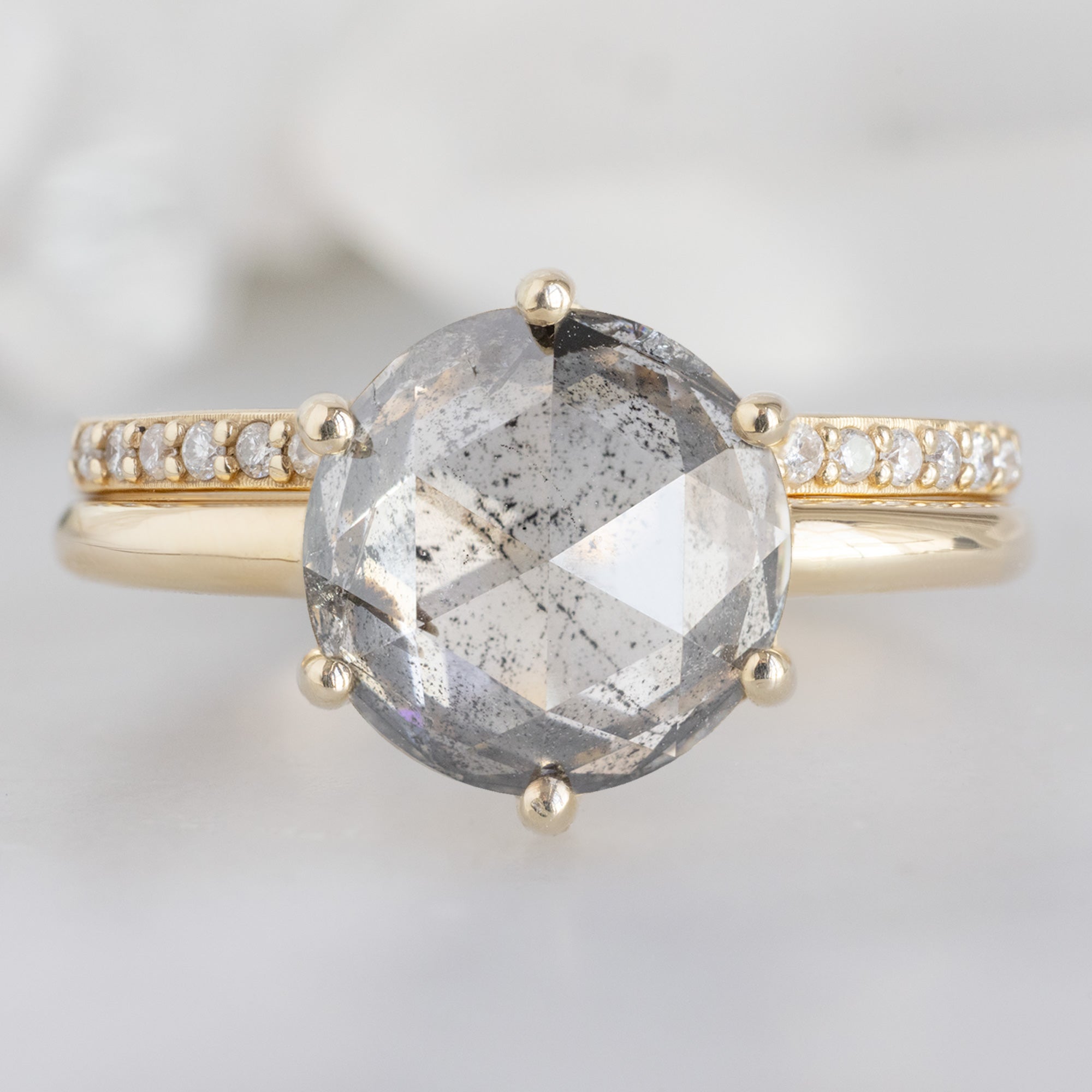 The Rose Ring with a 2.55ct Round Lab Grown Salt and Pepper Diamond in 14K Yellow Gold Stacked with the Open Cuff Pavé Diamond Stacking Band