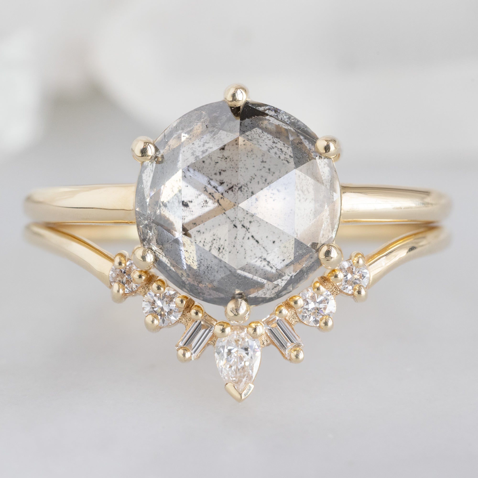 The Rose Ring with a 2.55ct Round Lab Grown Salt and Pepper Diamond in 14K Yellow Gold Stacked with the Geometric white Diamond Sunburst Stacking Band