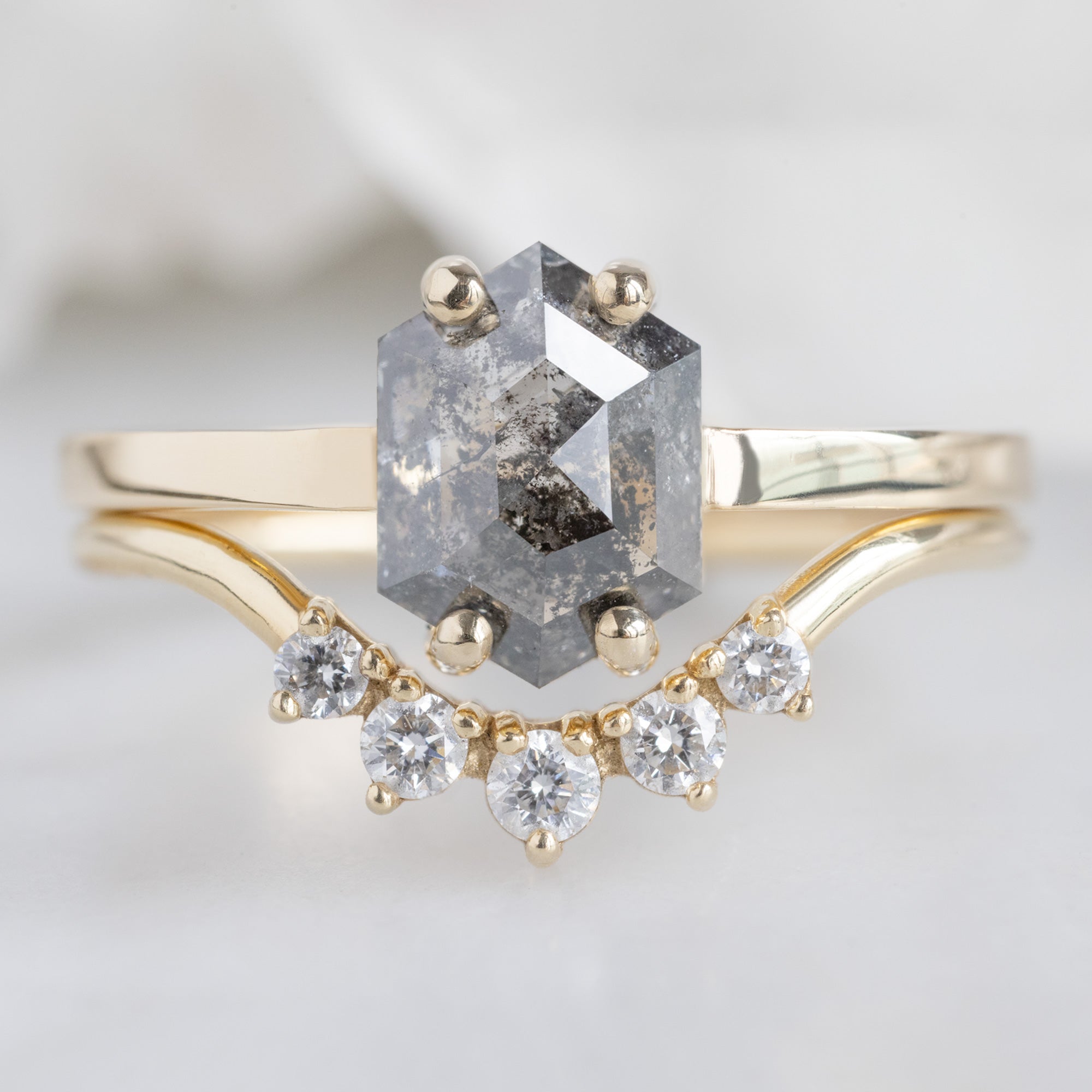 The Bryn Ring with a 1.42ct Hexagon Salt and Pepper Diamond in 14K Yellow Gold Stacked with the Round White Diamond Sunburst Stacking Band