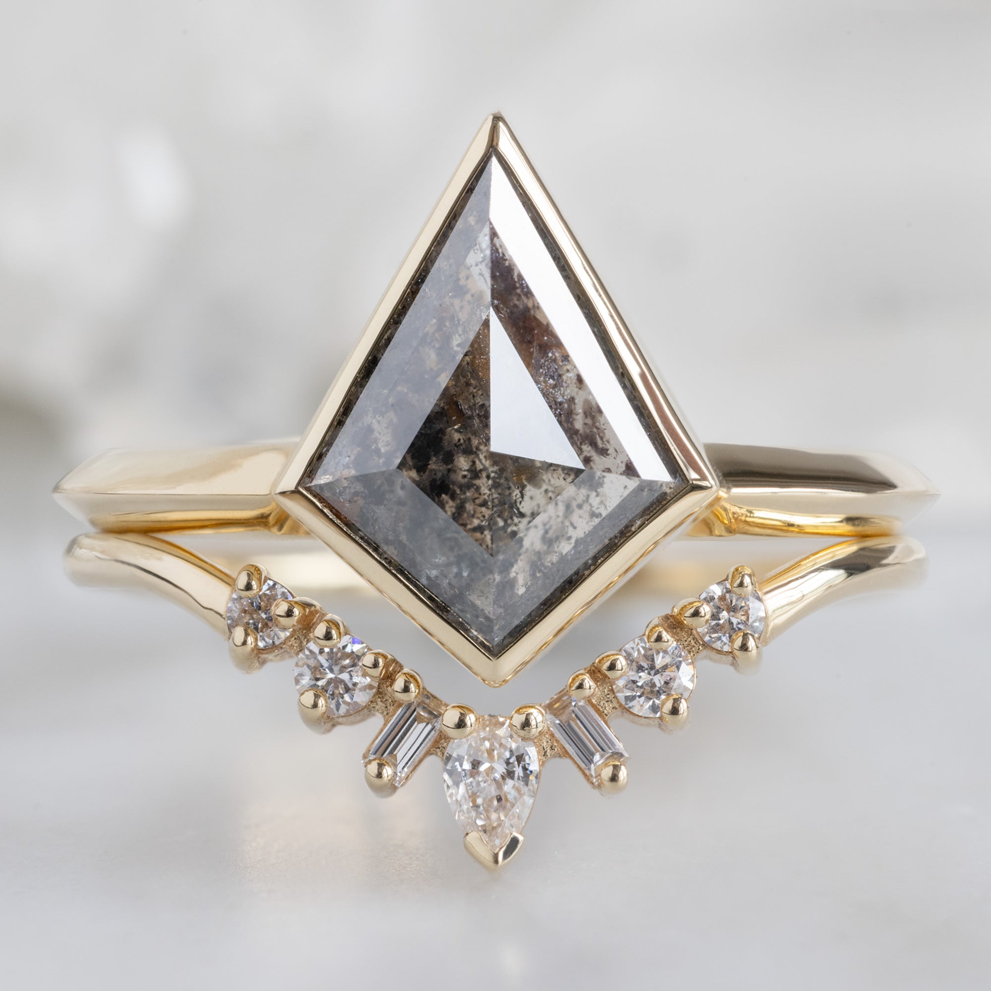 The Hazel Ring with a 2.05ct Kite Salt and Pepper Diamond in 14K Yellow Gold Stacked with the Geometric White Diamond Sunburst Stacking Band