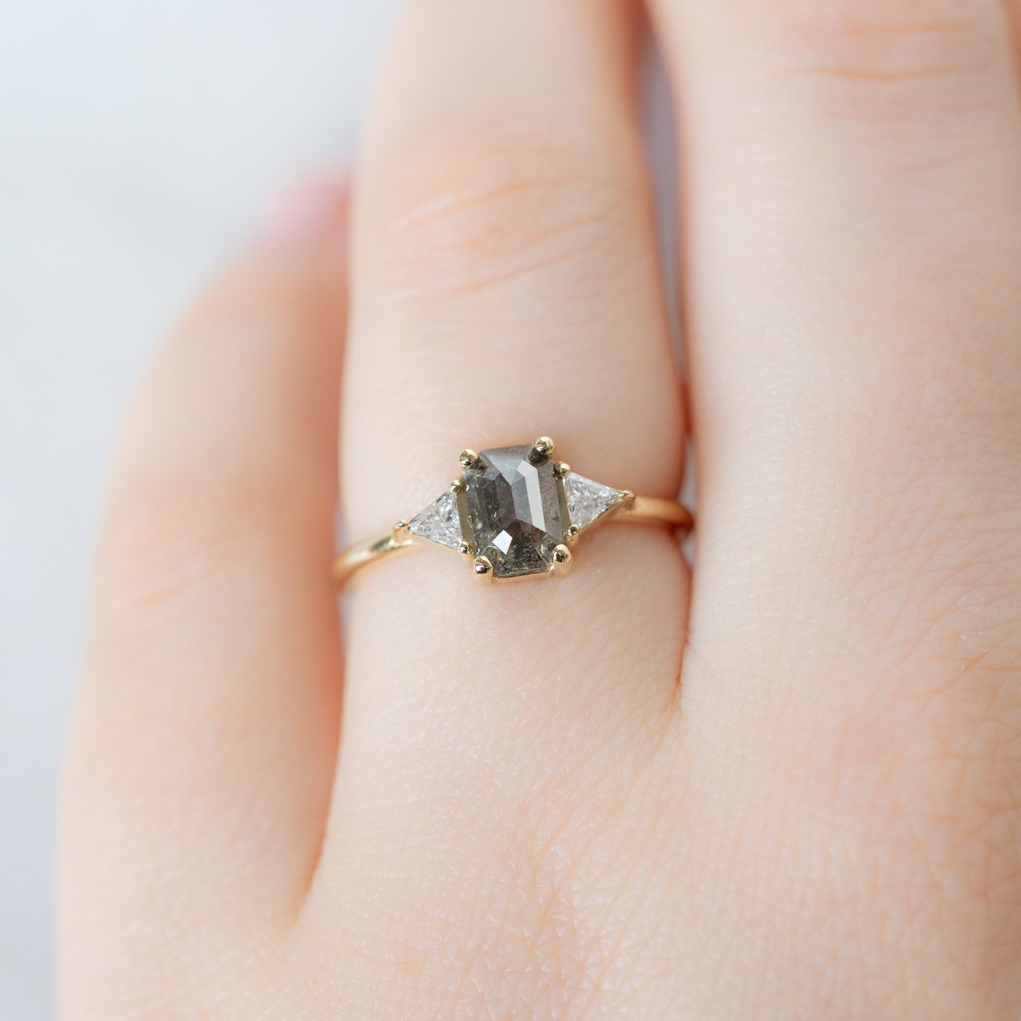 The Jade Ring with a 0.88ct Emerald Cut Salt and Pepper Diamond in 14K Yellow Gold on Model