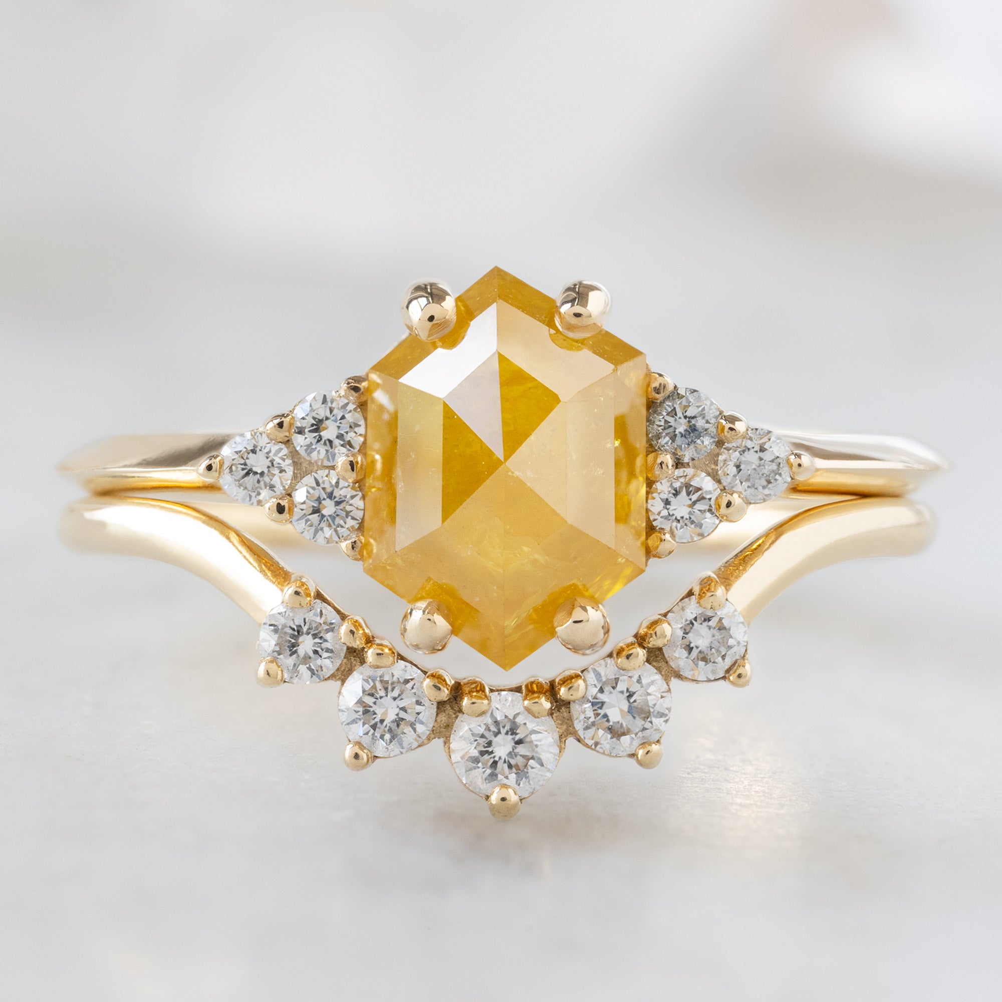 The Ivy Ring with a 1.48ct Hexagon Yellow Diamond in 14K Yellow Gold Stacked with the Round White Diamond Sunburst Stacking Band