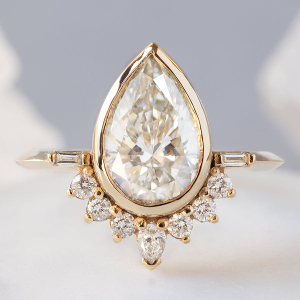 The Posy Ring with a 2.74ct Lab Grown Pear White Diamond in 14K Yellow Gold on White Marble