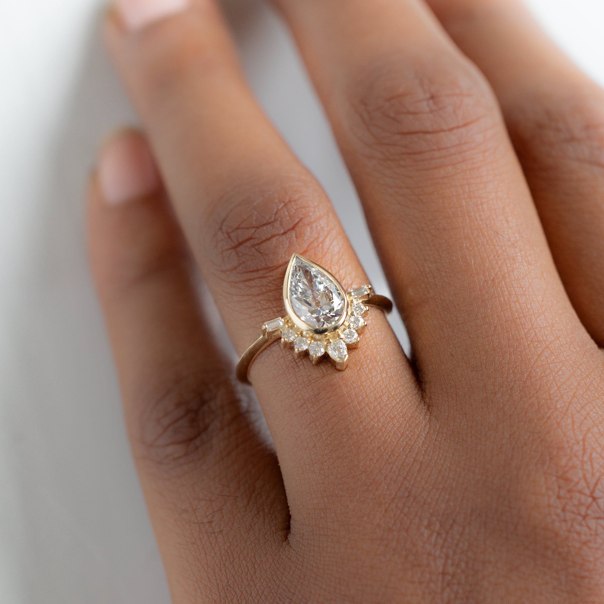 The Posy Ring with a 2.74ct Lab Grown Pear White Diamond in 14K Yellow Gold on Model
