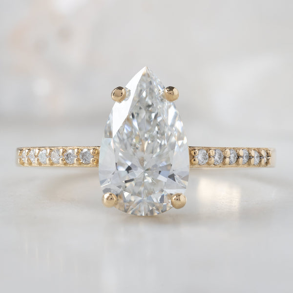 The Willow Ring with a 1.39ct Lab Grown Pear White Diamond in 14K Yellow Gold
on White Marble
