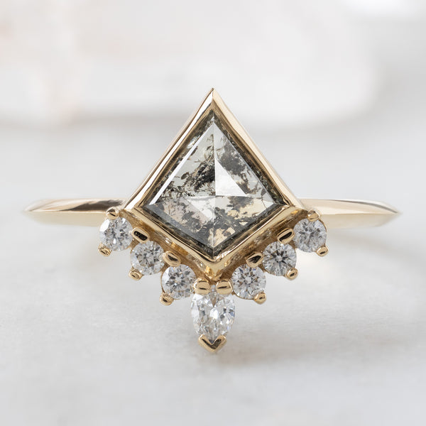 The Aster Ring with a 0.82ct Kite Salt and Pepper Diamond in 14K Yellow Gold on White Marble