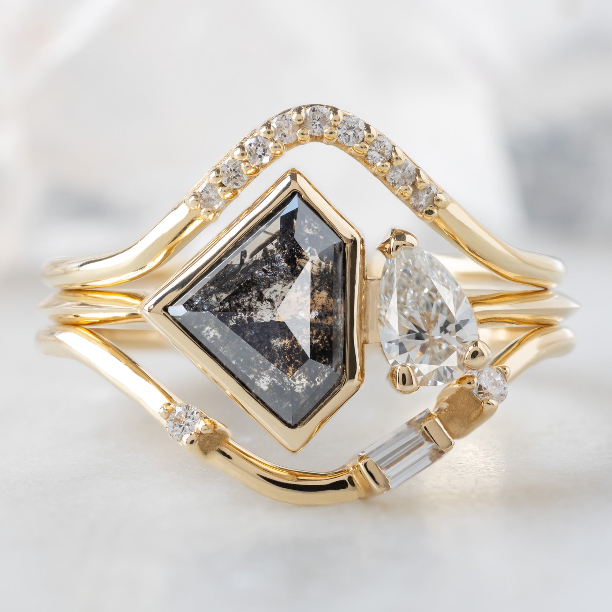 buy:or-18k-yellow-gold,the-you-me-ring-1-18ct-shield-salt-and-pepper-diamond-in-14k-yellow-gold,asymmetrical-baguette-diamond-arc-stacking-band-in-14k-yellow-gold