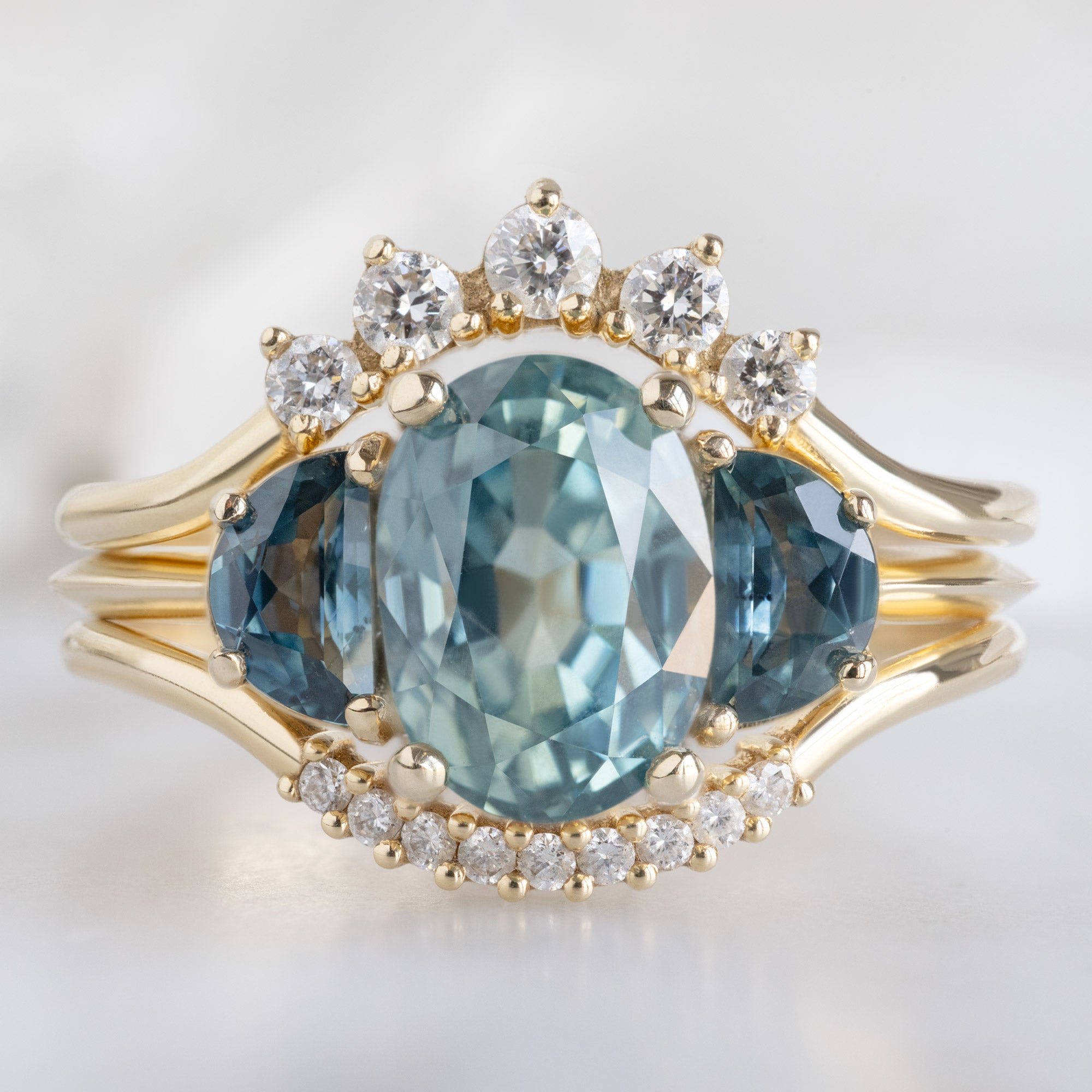 buy:round-white-diamond-sunburst-stacking-band-14k-or-18k-yellow-gold,the-monochrome-ring-2-42ct-oval-sapphire-in-14k-yellow-gold,white-diamond-pave-arc-stacking-band-14k-or-18k-yellow-gold