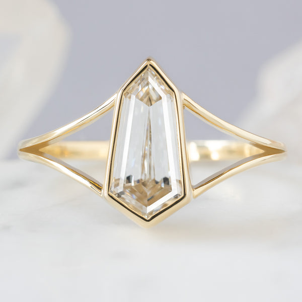 The Magnolia Ring with a 1.50ct Lab Grown Geometric White Diamond in 14K Yellow Gold on White Marble Tile