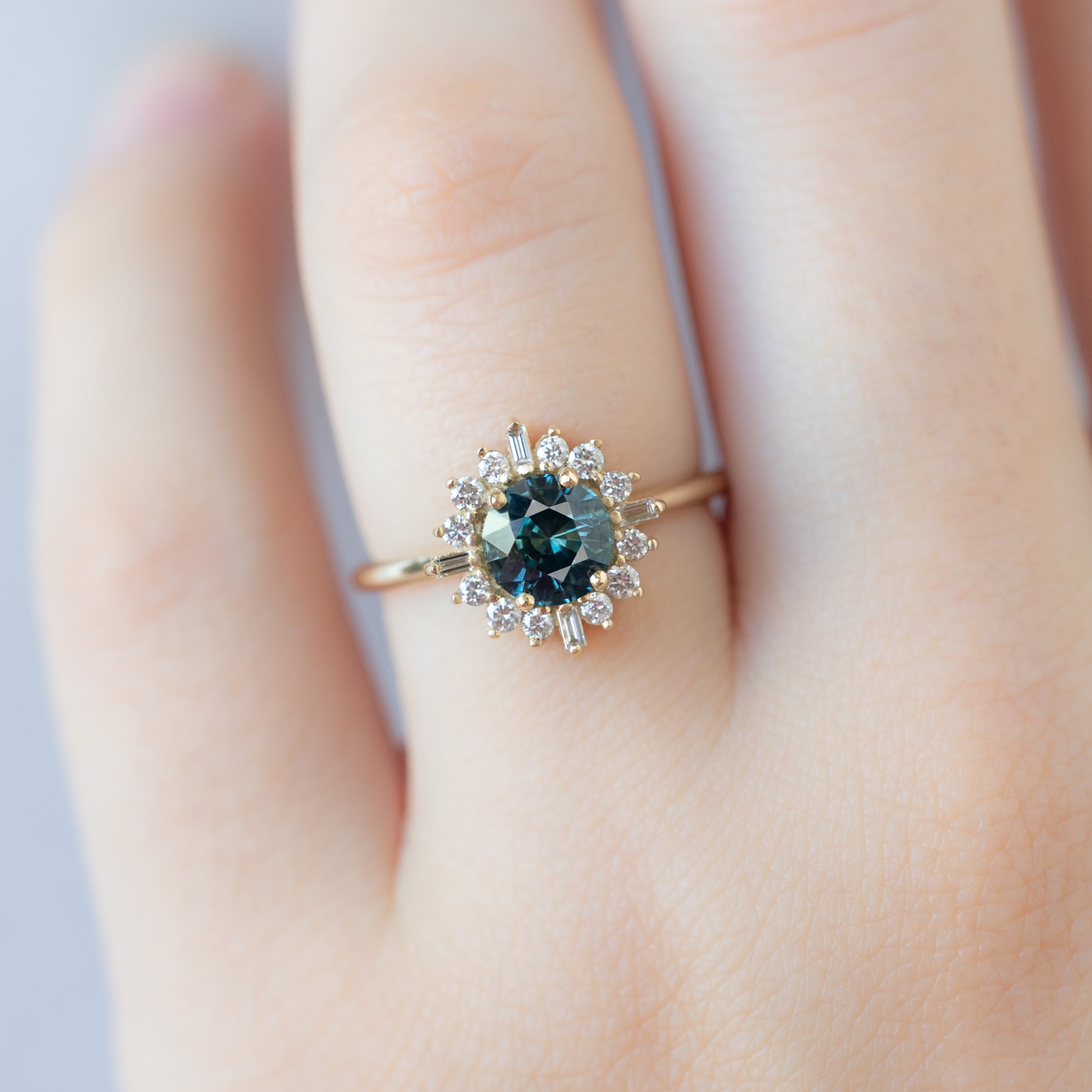 The Compass Ring with a 1.19ct Round Blue Sapphire in 14K Yellow Gold on Model