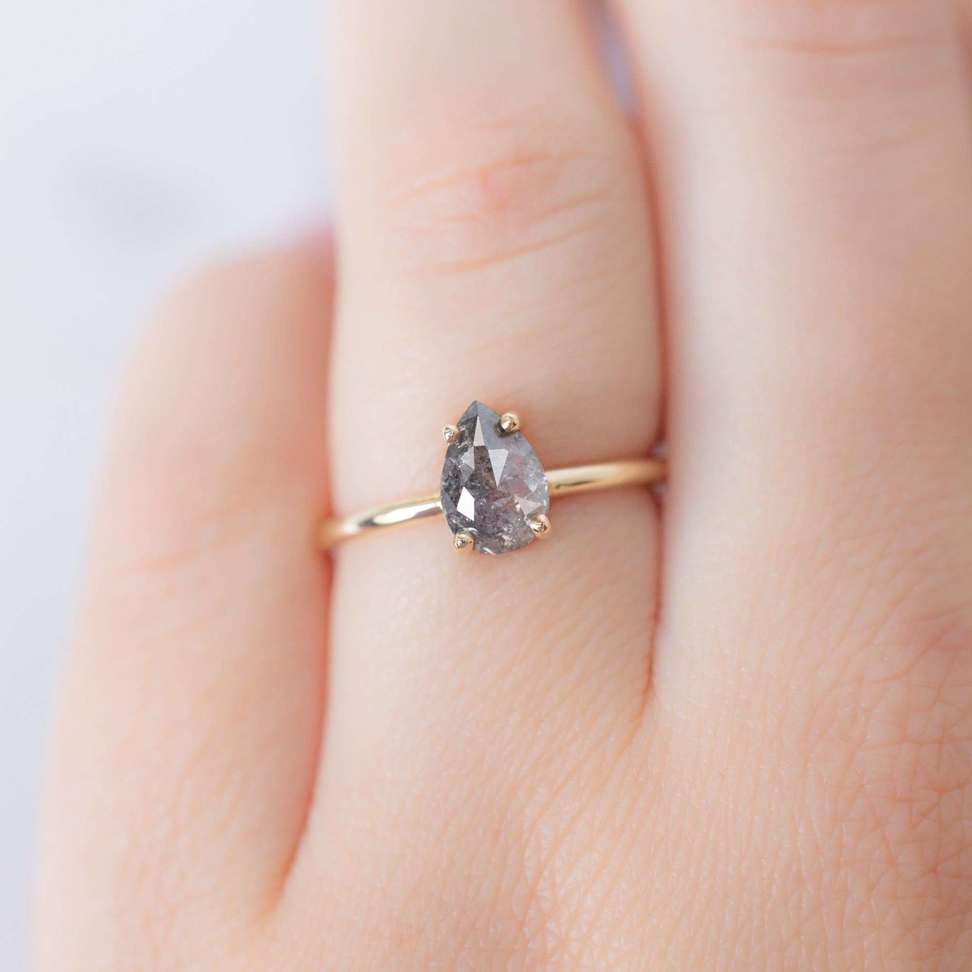 The Bryn Ring with a 1.01ct Pear Salt and Pepper Diamond in 14K Yellow Gold on Model