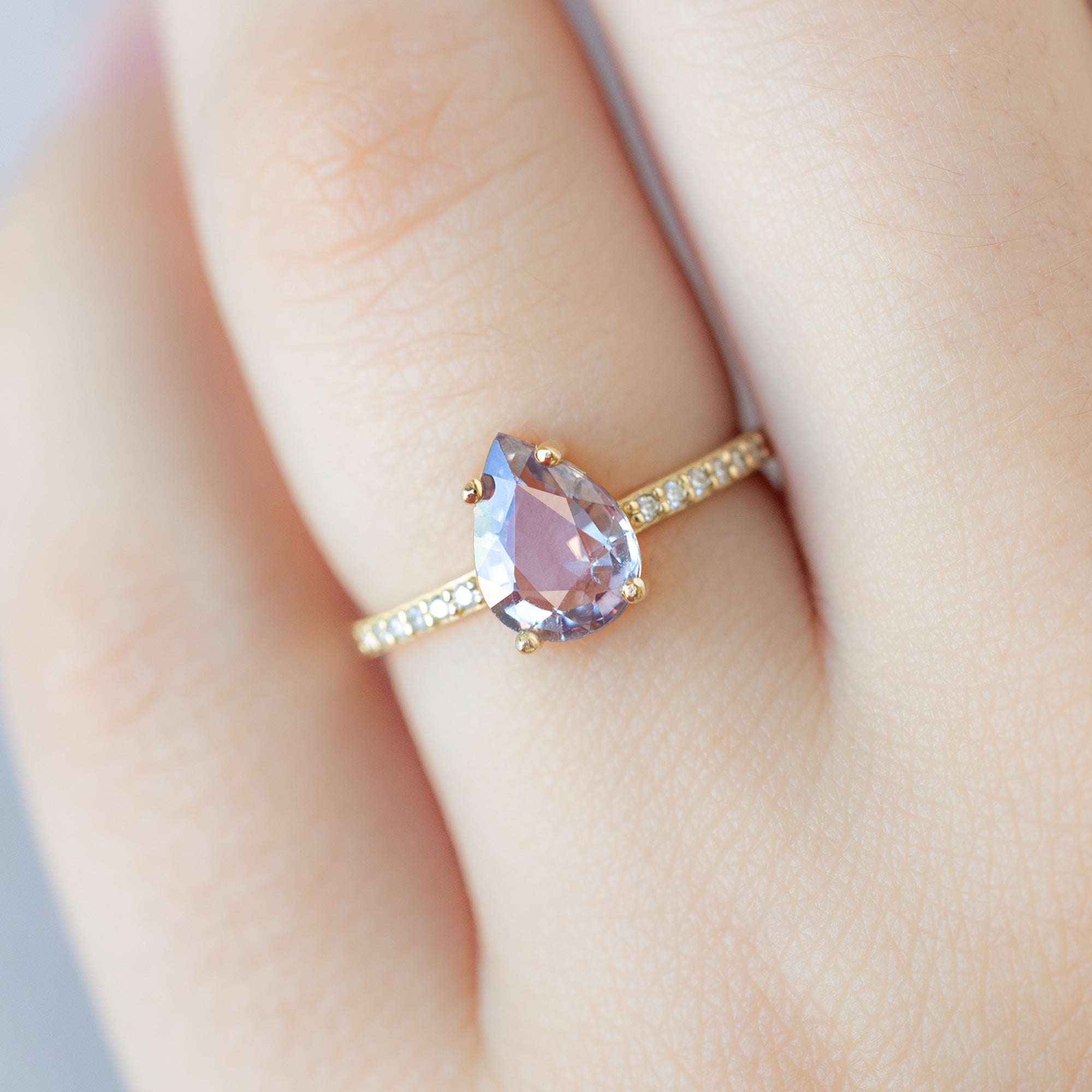 The Willow Ring with a 1.38ct Pear Violet Sapphire in 14K Yellow Gold on Model